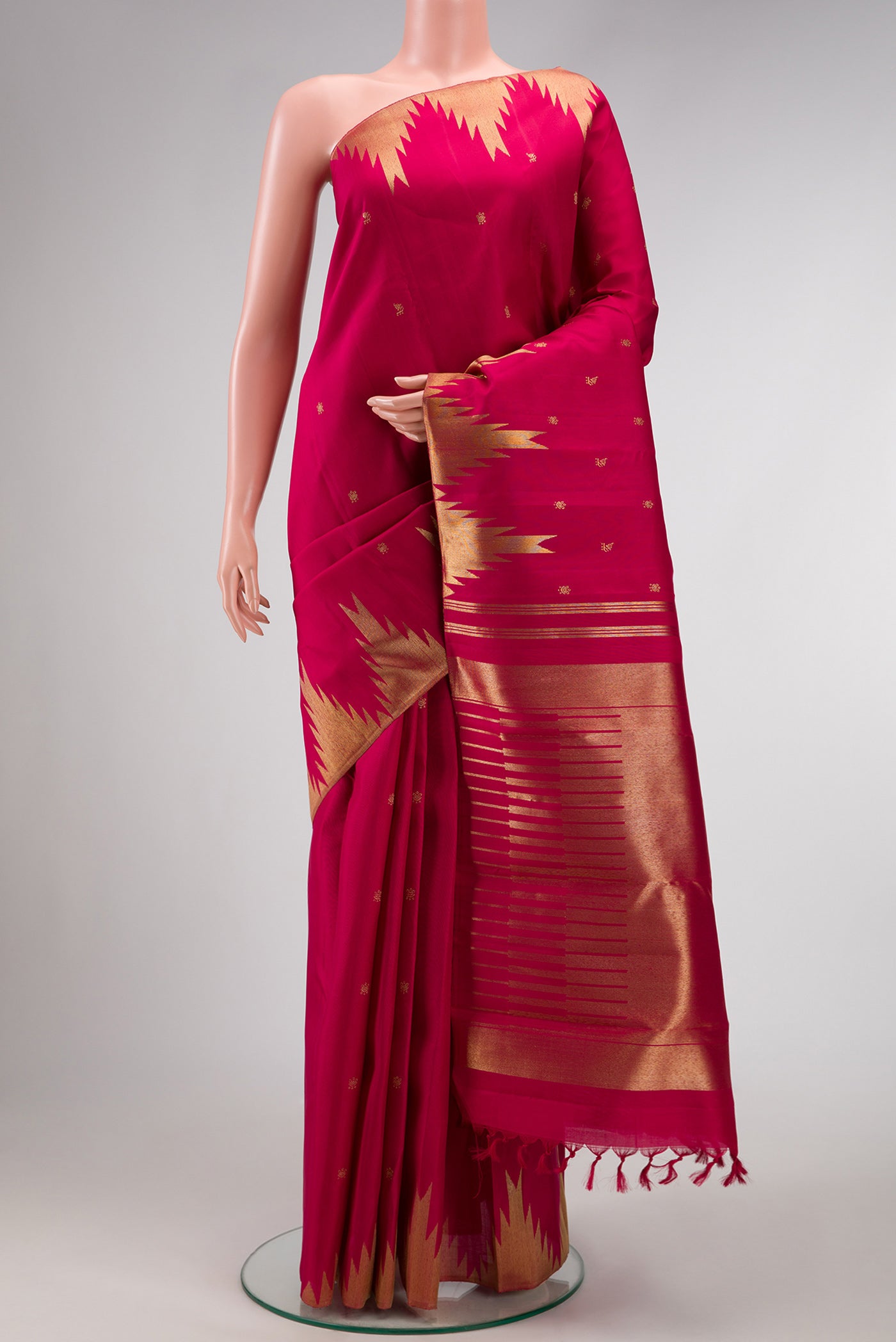 Maroon Dual Tone Kanchipuram Silk Saree with Zari Butta on the body and Temple Border.  displayed on a mannequin
