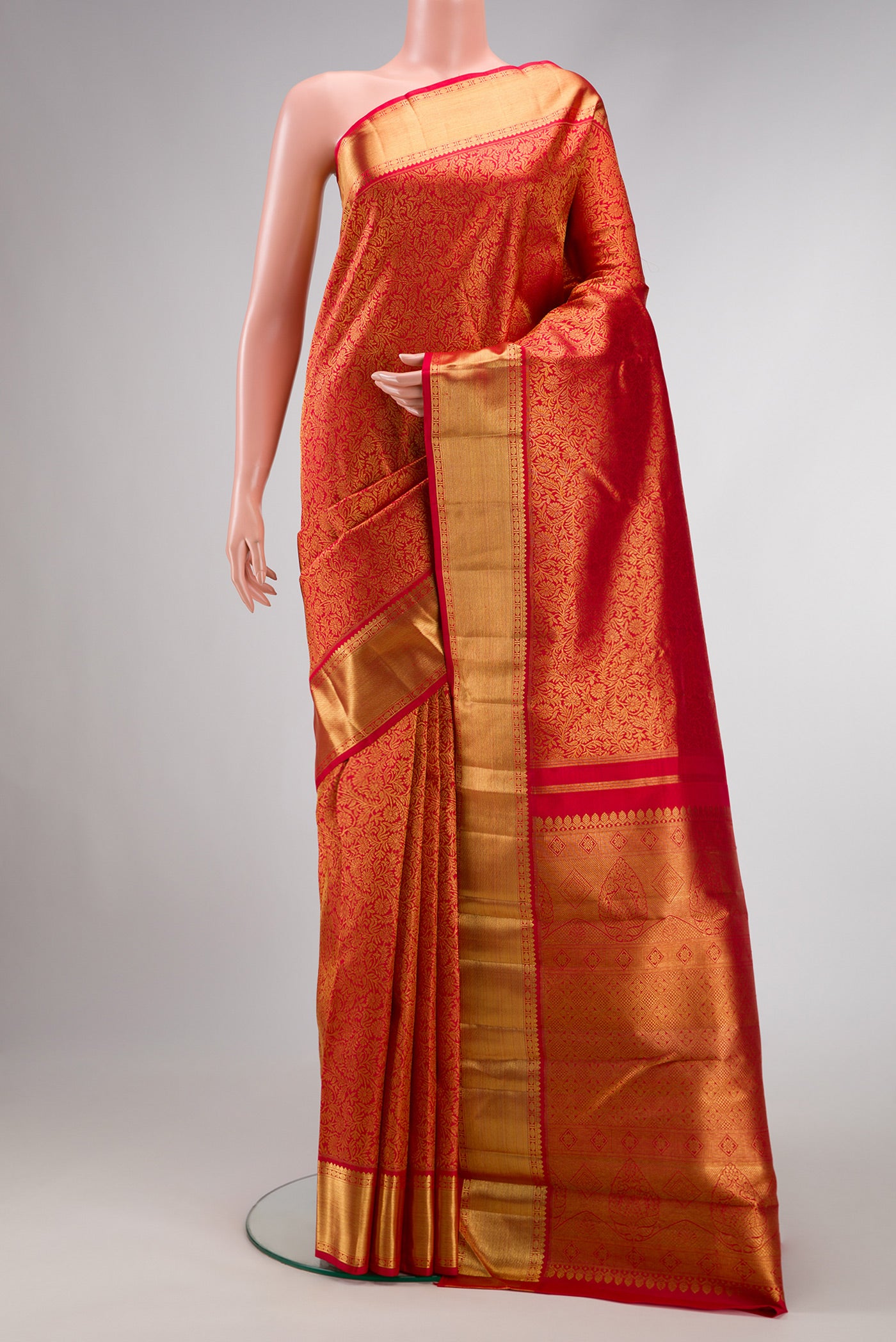 Dark Pink Dual Tone Kanchipuram Silk Saree with Zari Brocade on the body and Zari Border.  displayed on a mannequin