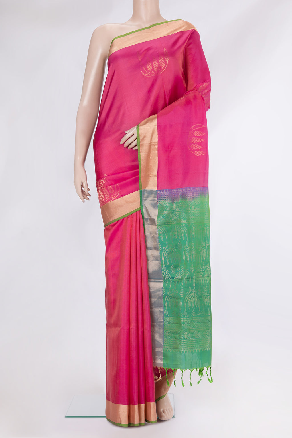 Pink Soft Silk Saree with Zari Butta on the body and Zari Border.  displayed on a mannequin