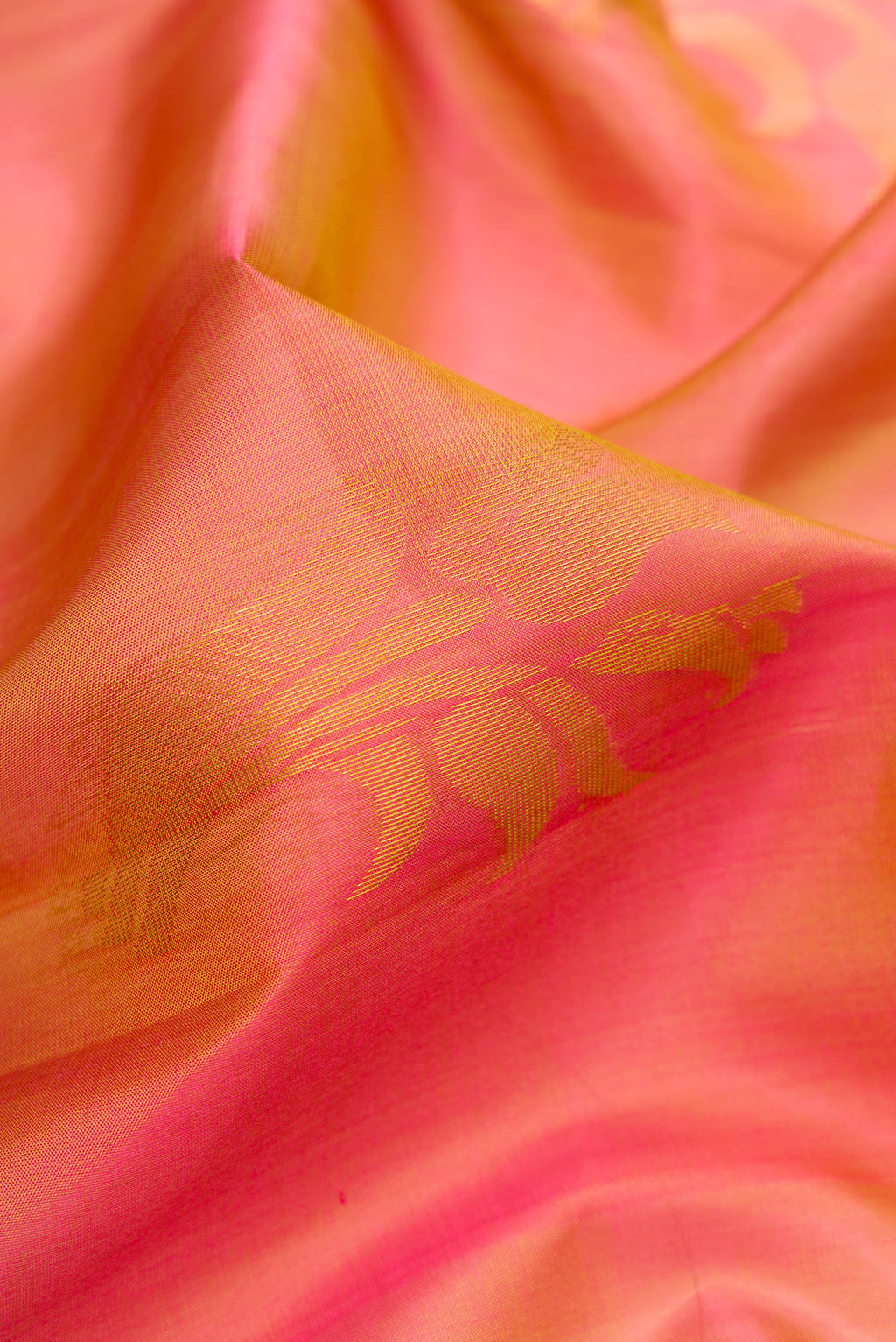 Close up of Mustard Dual Tone Soft Silk Saree with Zari Butta on the body and Zari Border.  displaying folds