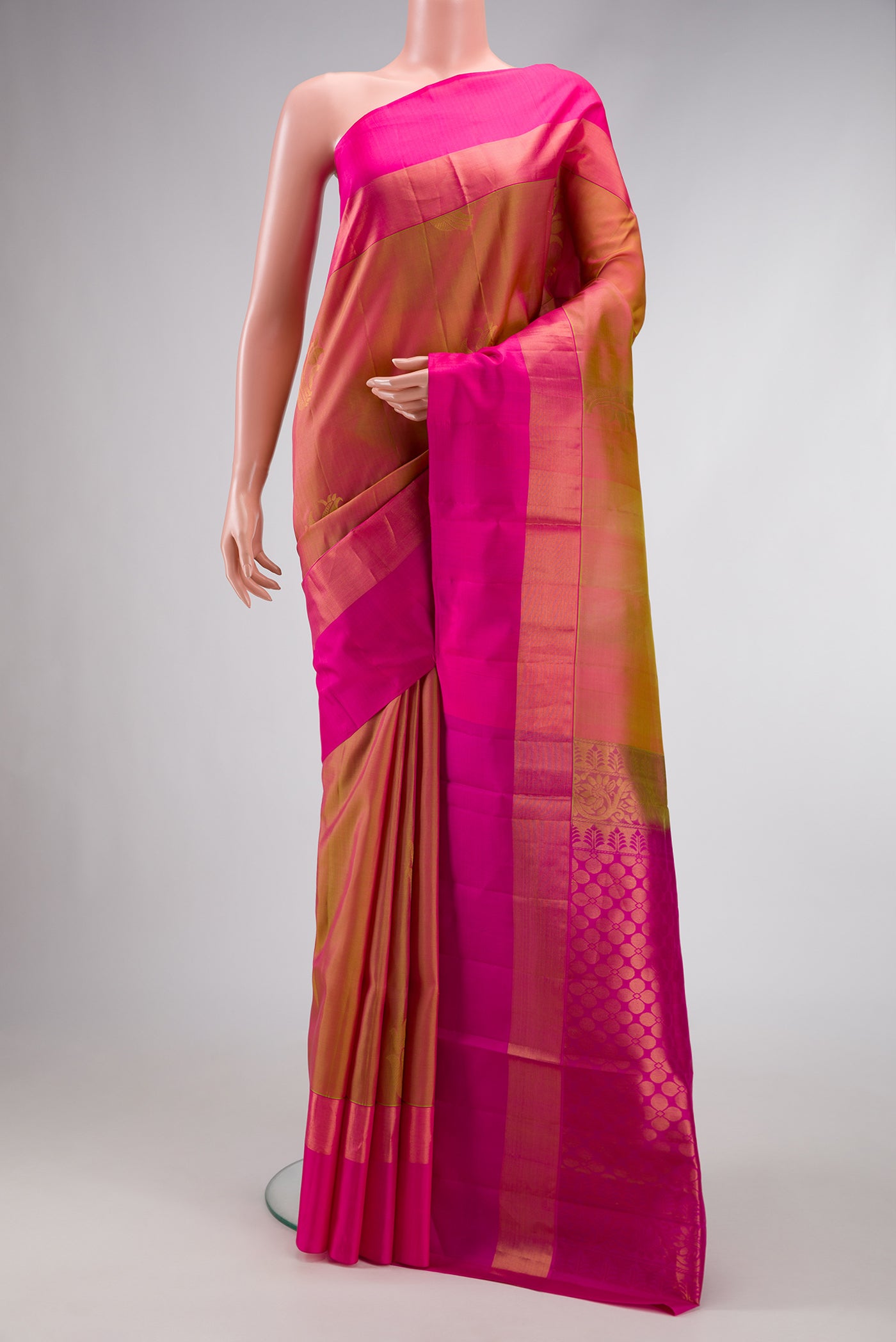 Mustard Dual Tone Soft Silk Saree with Zari Butta on the body and Zari Border.  displayed on a mannequin