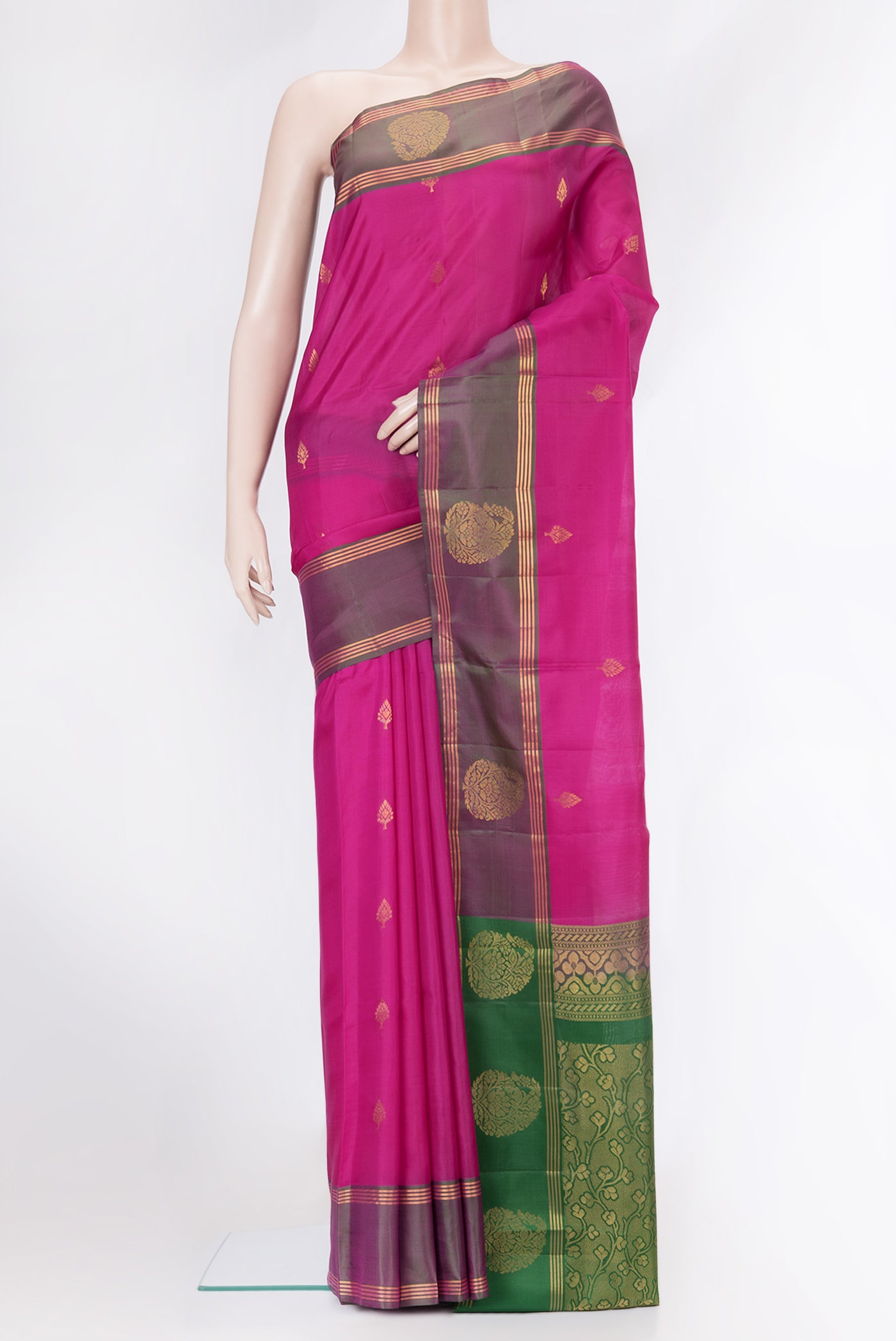 Magenta Soft Silk Saree with Zari Butta on the body and Fancy Border.  displayed on a mannequin