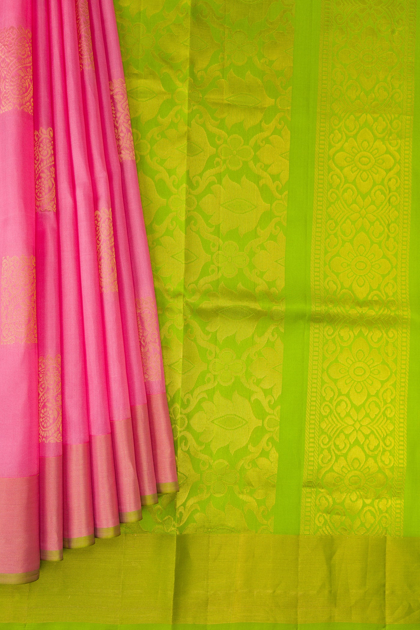 Pleats and pallu of Pink Soft Silk Saree with Zari Butta on the body and Zari Border. 