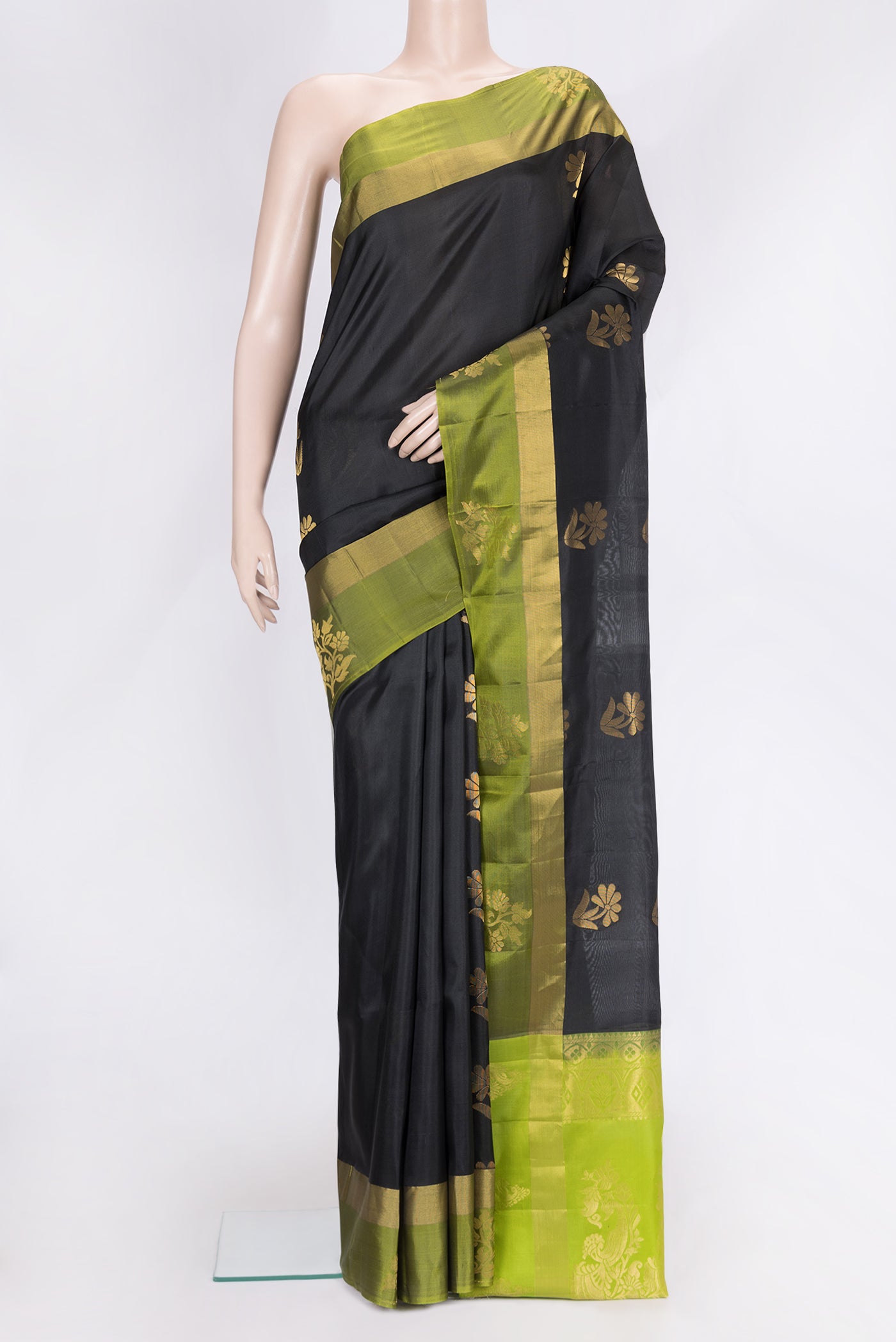Black Dual Tone Soft Silk Saree with Zari Butta on the body and Fancy Border.  displayed on a mannequin