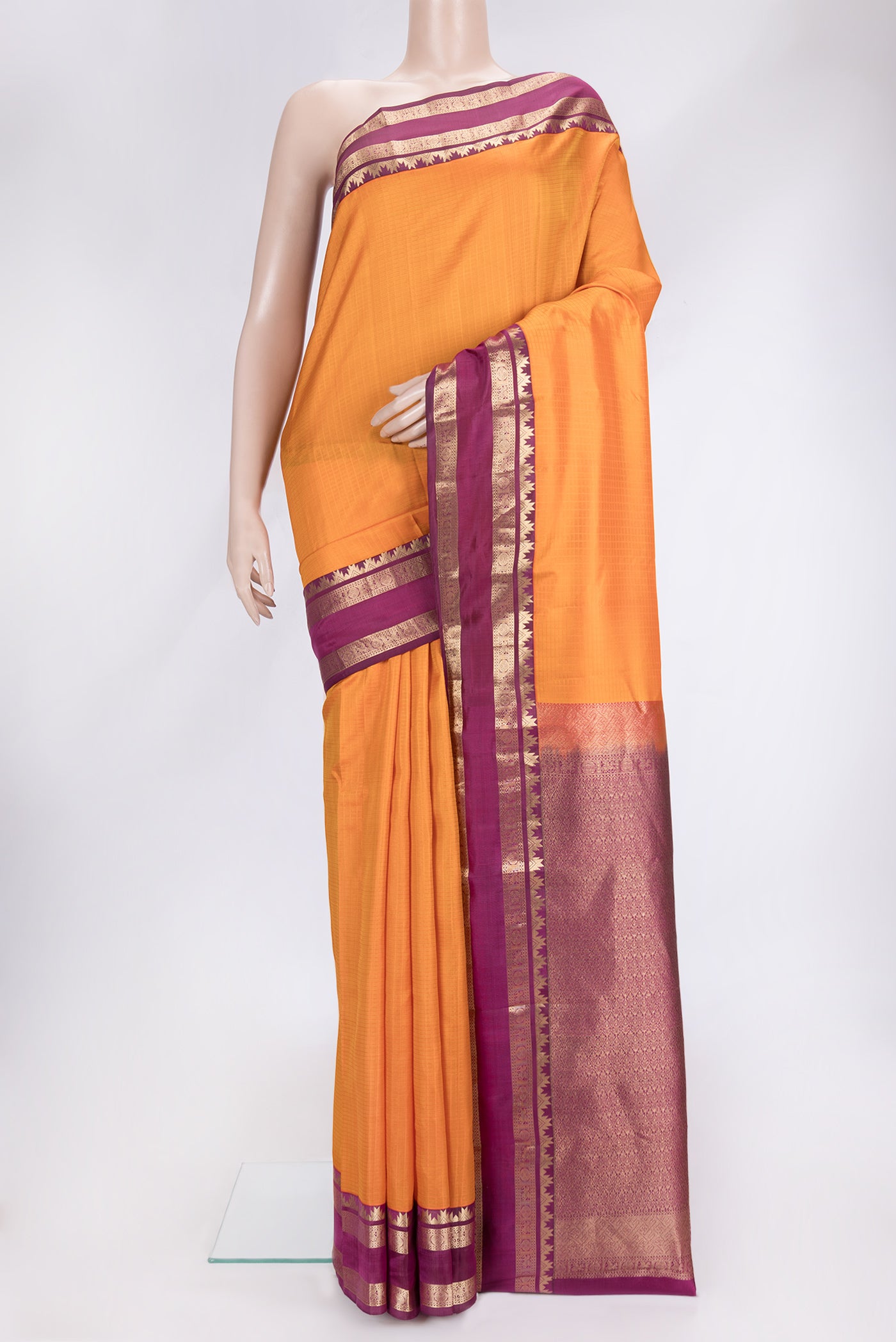 Orange Dual Tone Kanchipuram Silk Saree with Checked design on the body and Zari Border.  displayed on a mannequin