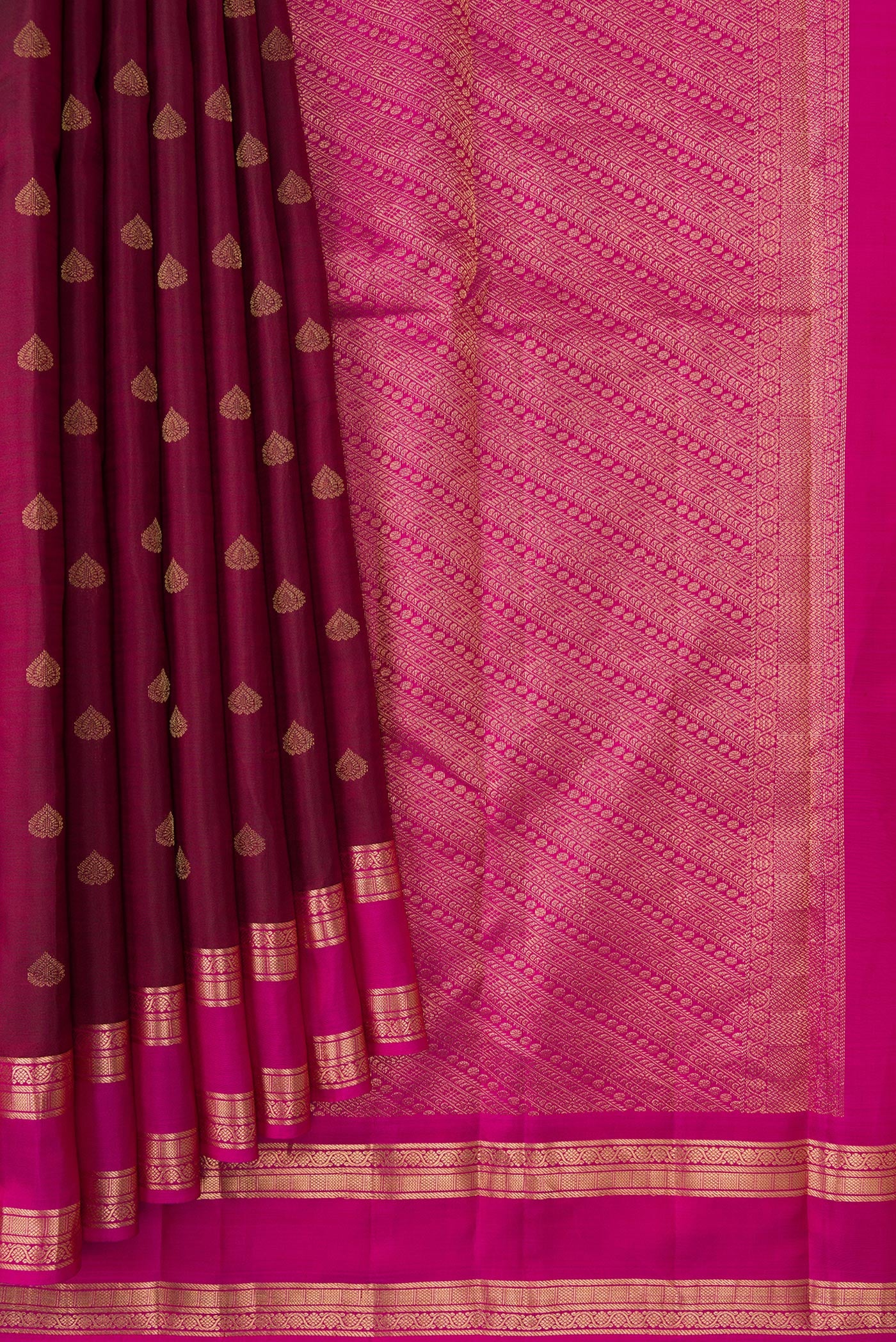 Pleats and pallu of Coffee Brown Dual Tone Kanchipuram Silk Saree with Zari Butta on the body and Zari Border. 