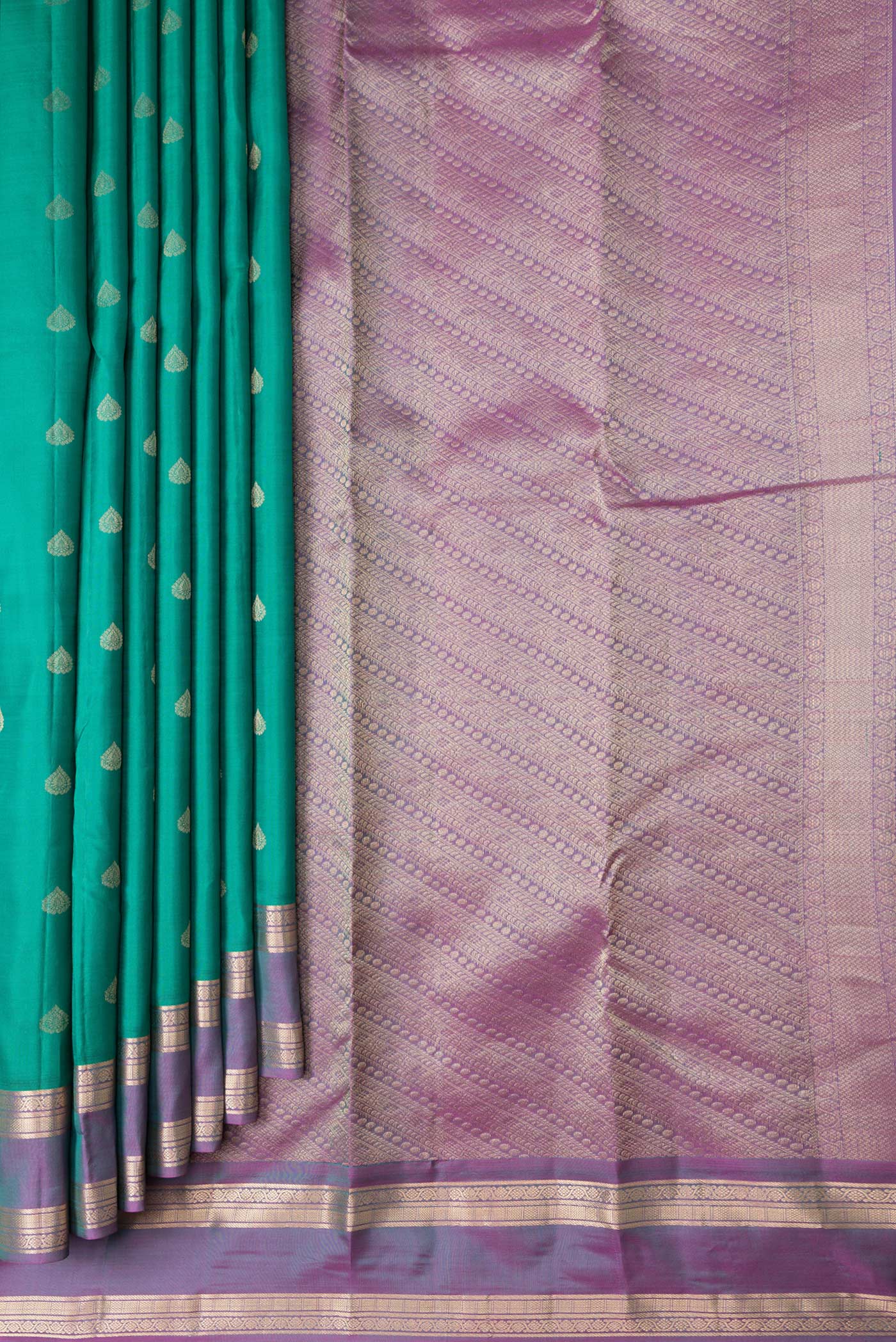 Pleats and pallu of Green Dual Tone Kanchipuram Silk Saree with Zari Butta on the body and Zari Border. 