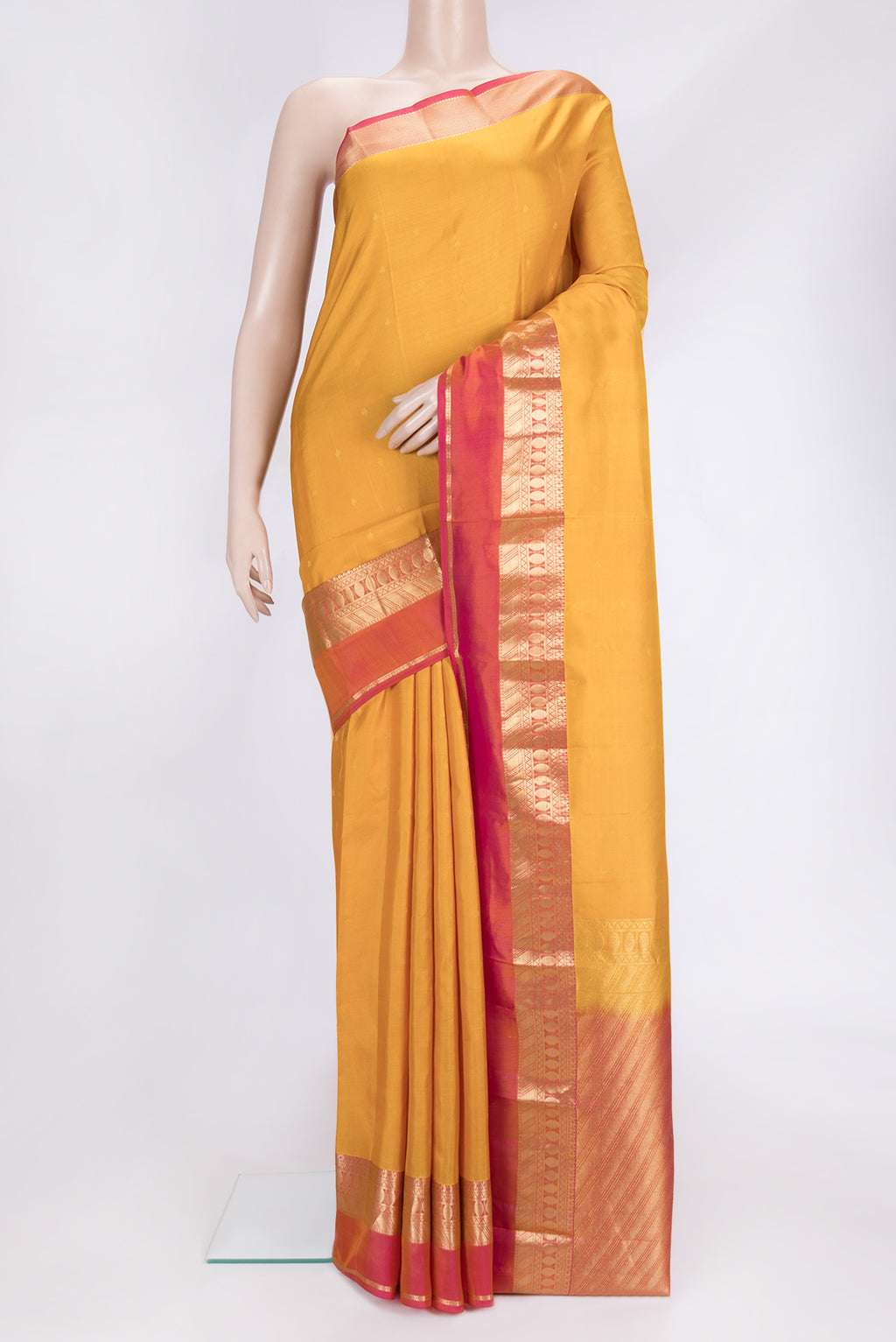 Yellow Dual Tone Kanchipuram Silk Saree with Zari Butta on the body and Zari Border.  displayed on a mannequin