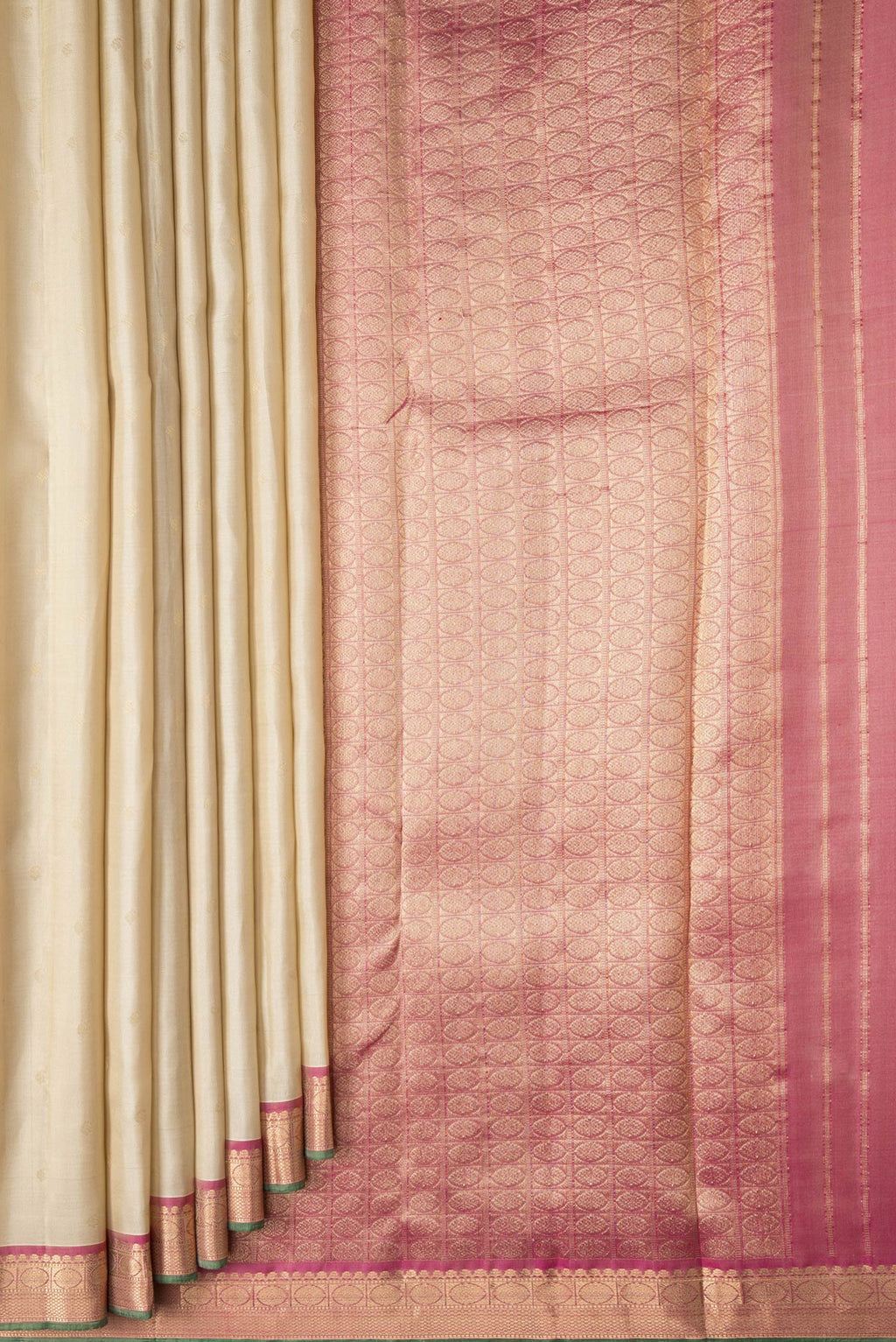 Pleats and pallu of Beige Dual Tone Kanchipuram Silk Saree with Zari Butta on the body and Zari Border. 