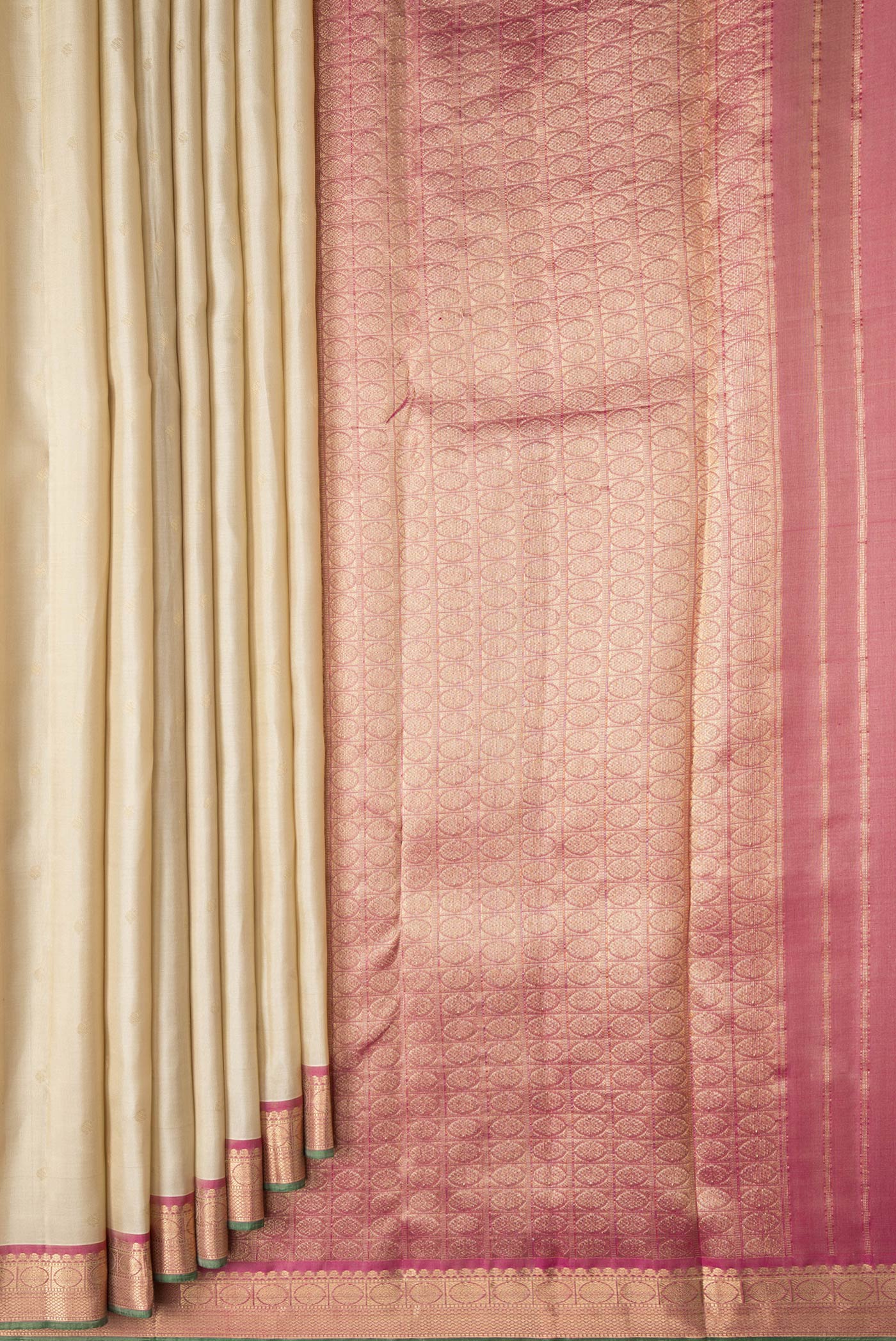 Pleats and pallu of Beige Dual Tone Kanchipuram Silk Saree with Zari Butta on the body and Zari Border. 