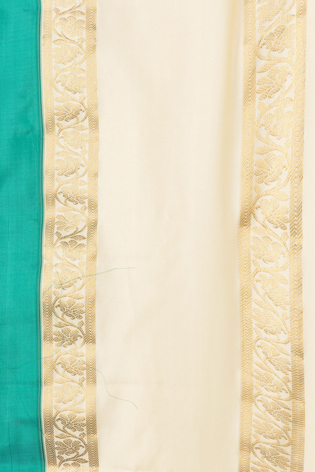 Border image of Green Dual Tone Kanchipuram Silk Saree with Plain Body and Zari Border. 