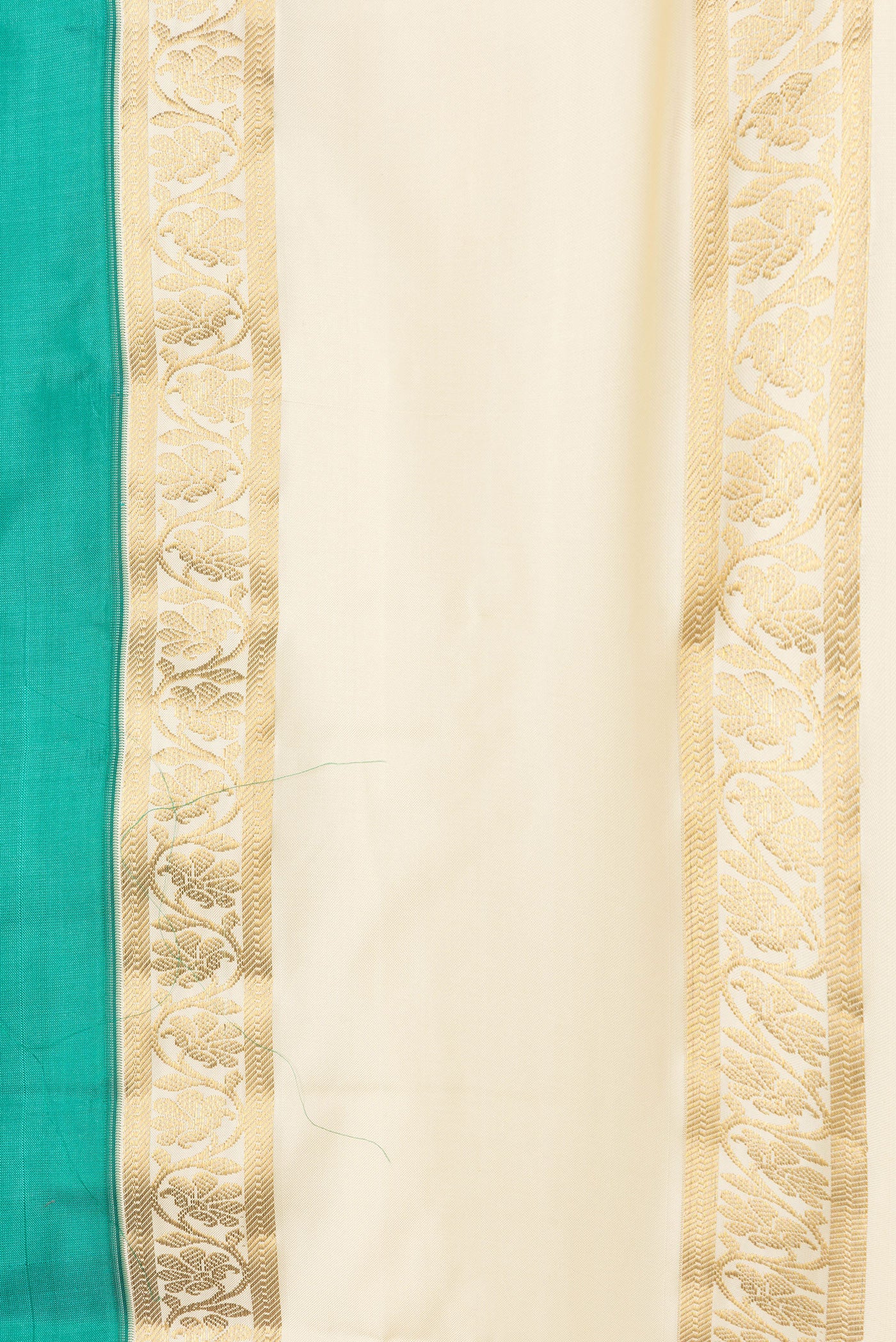 Border image of Green Dual Tone Kanchipuram Silk Saree with Plain Body and Zari Border. 