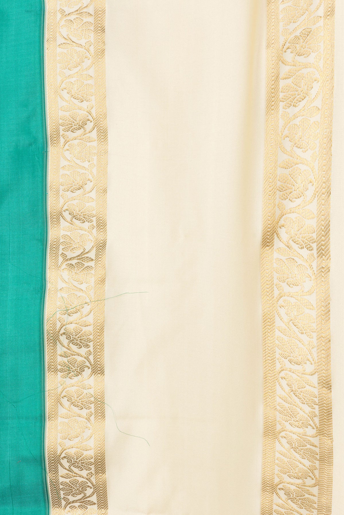 Border image of Green Dual Tone Kanchipuram Silk Saree with Plain Body and Zari Border. 