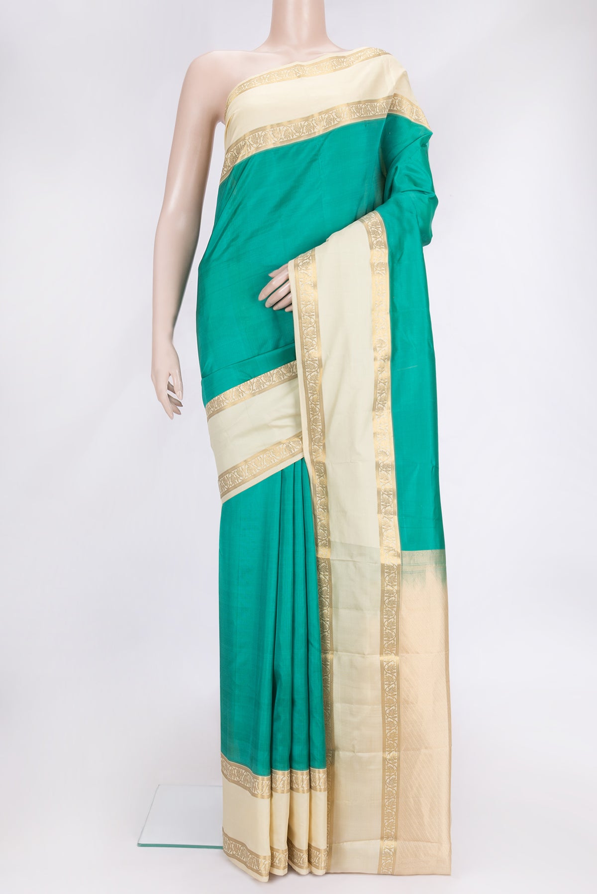 Green Dual Tone Kanchipuram Silk Saree with Plain Body and Zari Border.  displayed on a mannequin