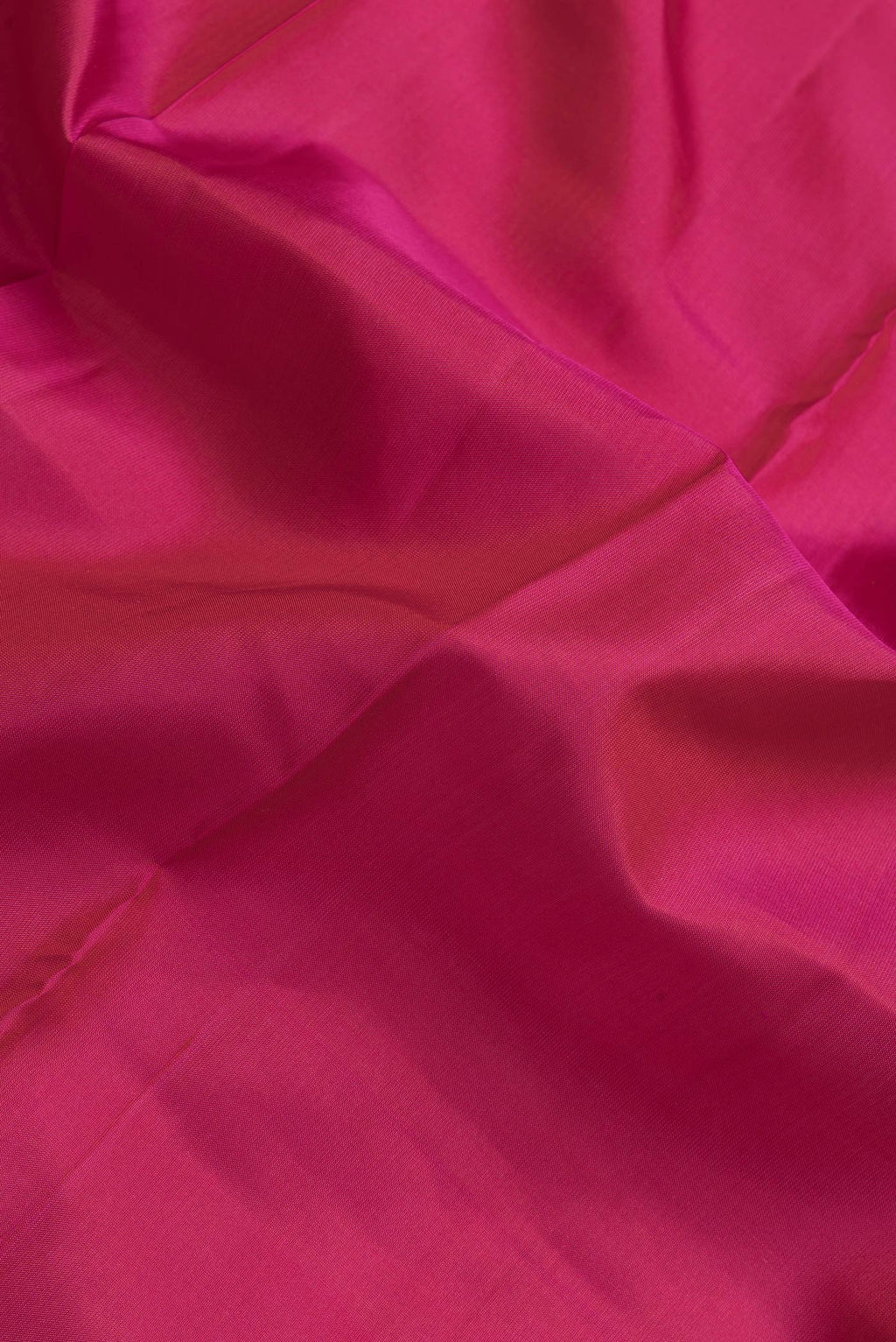 Close up of Pink Dual Tone Kanchipuram Silk Saree with Plain Body and Zari Border.  displaying folds