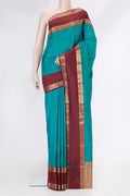 Peacock Blue Kanchipuram Silk Saree with Plain Body and Zari Border.  displayed on a mannequin