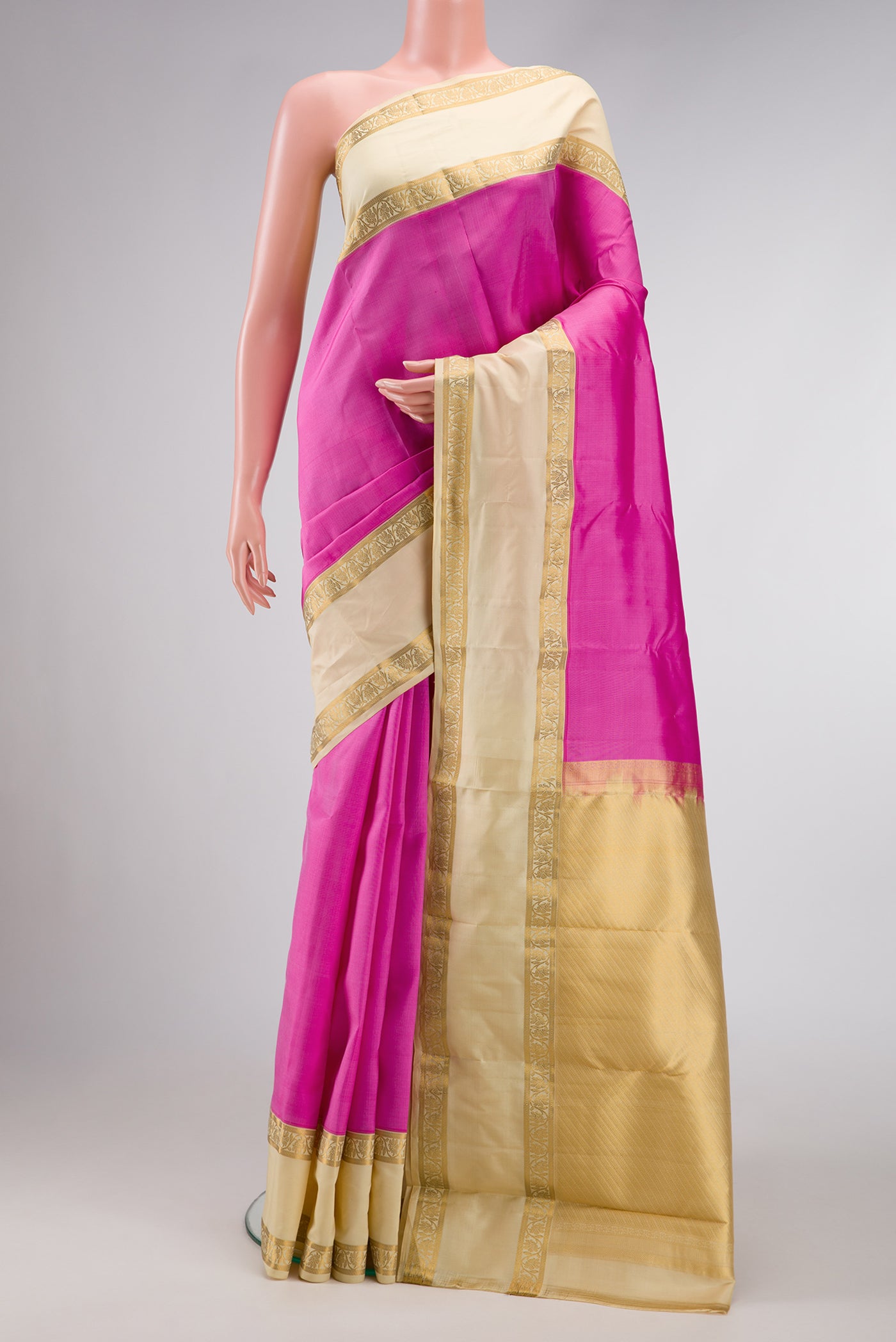 Pink Dual Tone Kanchipuram Silk Saree with Plain Body and Zari Border.  displayed on a mannequin