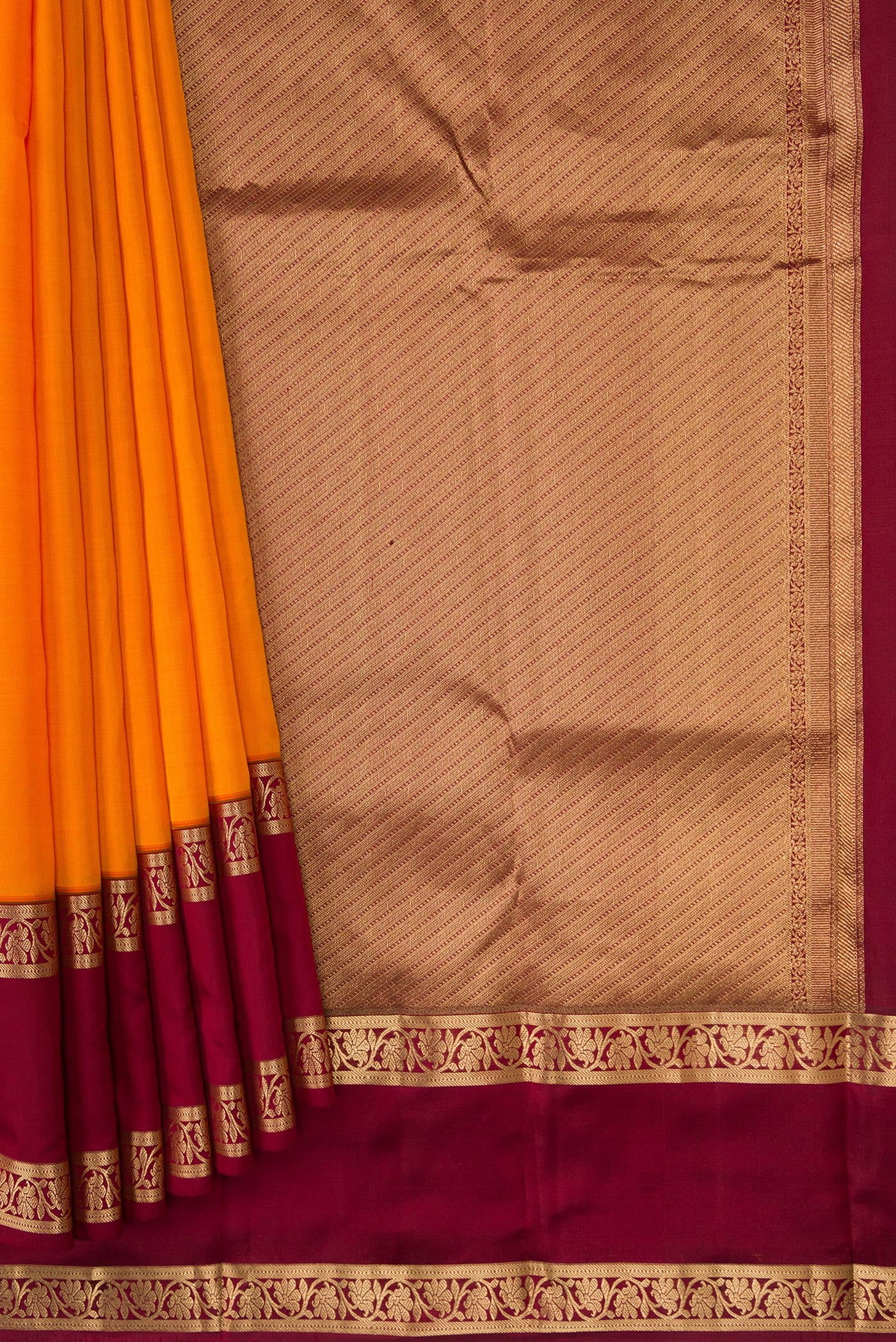 Pleats and pallu of Orange Dual Tone Kanchipuram Silk Saree with Plain Body and Zari Border. 