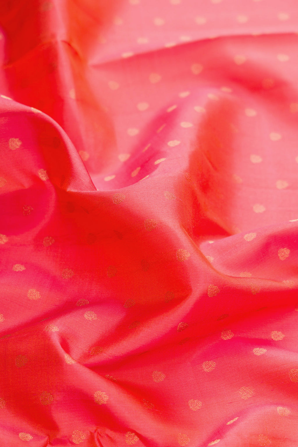 Close up of Pink Dual Tone Kanchipuram Silk Saree with Zari Butta on the body and Zari Border.  displaying folds