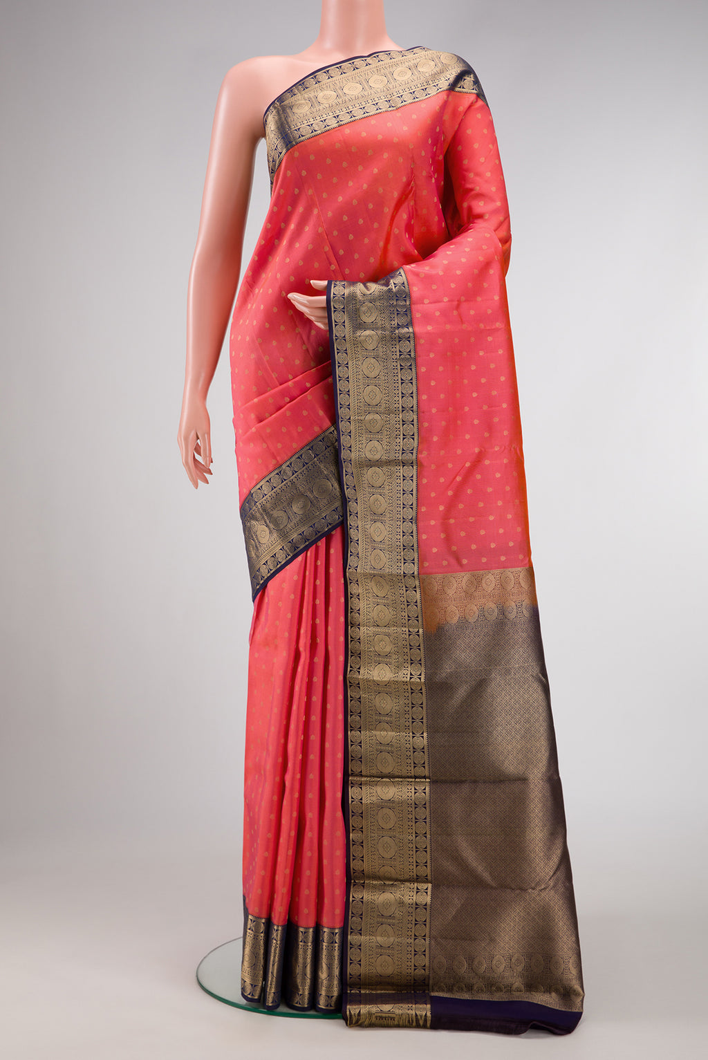 Pink Dual Tone Kanchipuram Silk Saree with Zari Butta on the body and Zari Border.  displayed on a mannequin