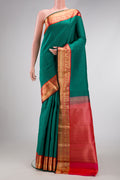 Green Dual Tone Kanchipuram Silk Saree with Stripes on the body and Zari Border.  displayed on a mannequin