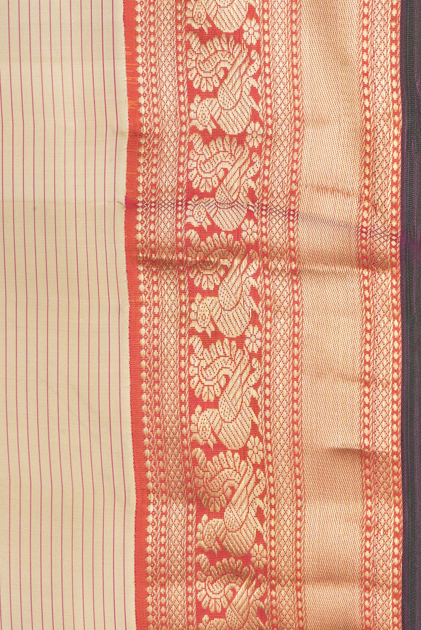 Border image of Beige Dual Tone Kanchipuram Silk Saree with Stripes on the body and Zari Border. 