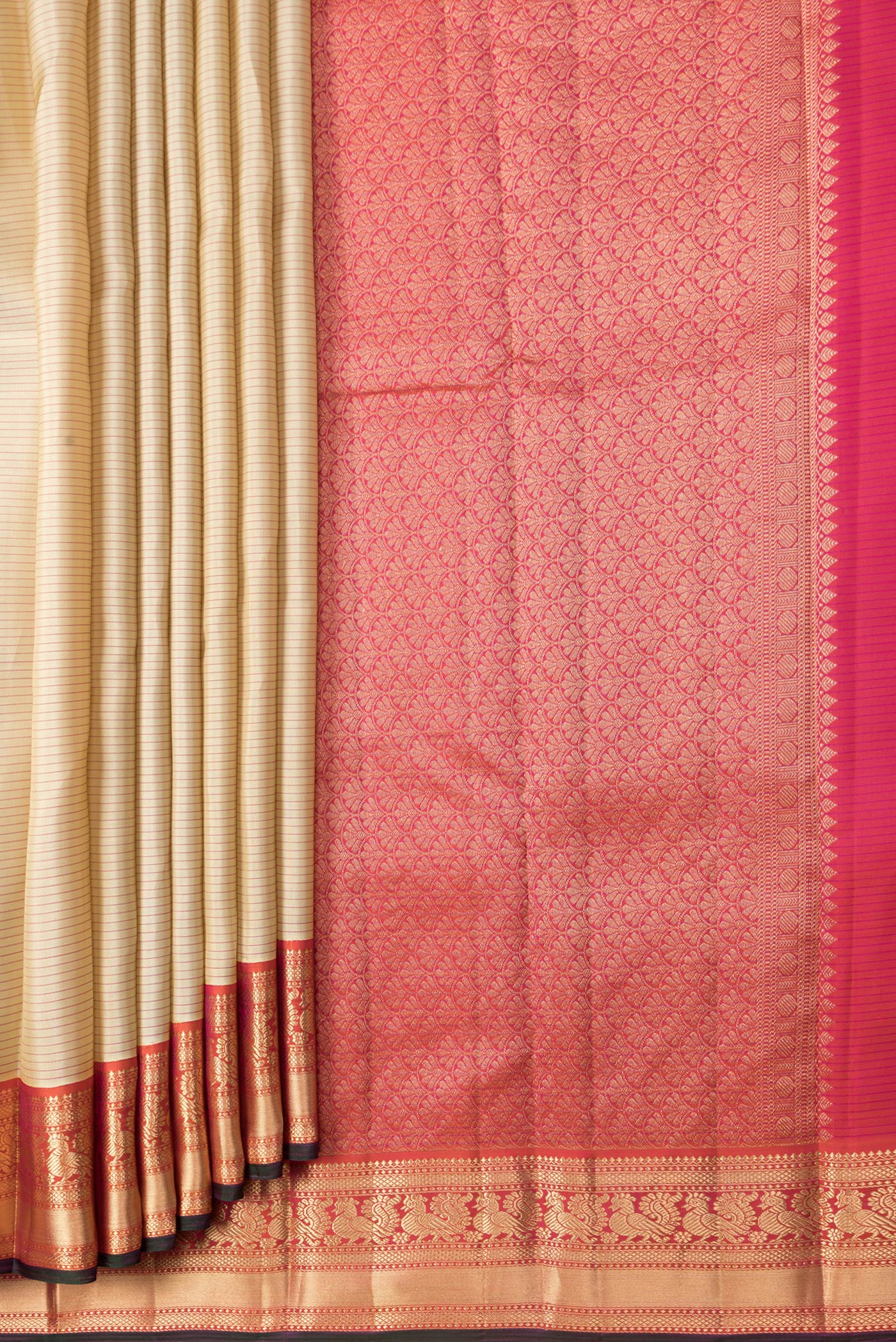 Pleats and pallu of Beige Dual Tone Kanchipuram Silk Saree with Stripes on the body and Zari Border. 