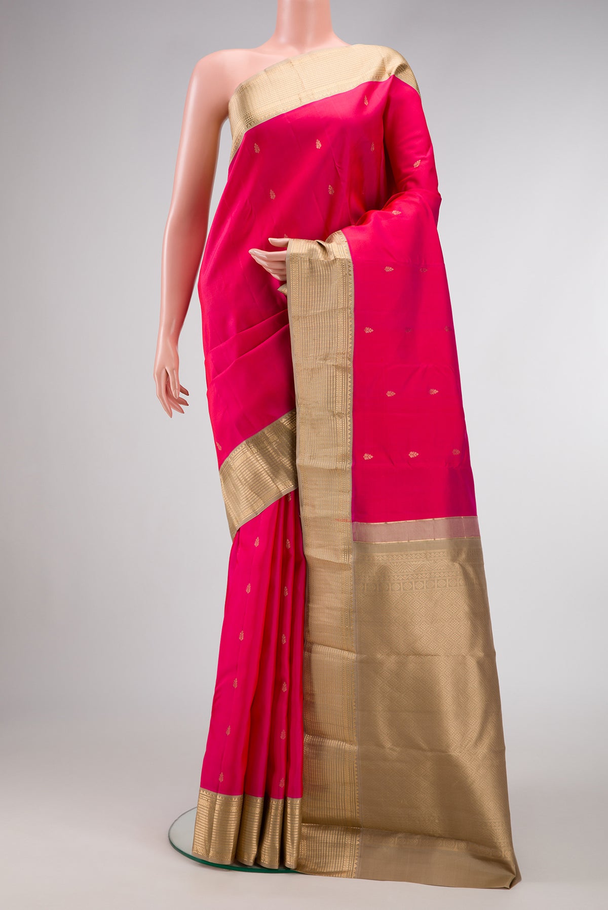 Pink Dual Tone Kanchipuram Silk Saree with Zari Butta on the body and Zari Border.  displayed on a mannequin