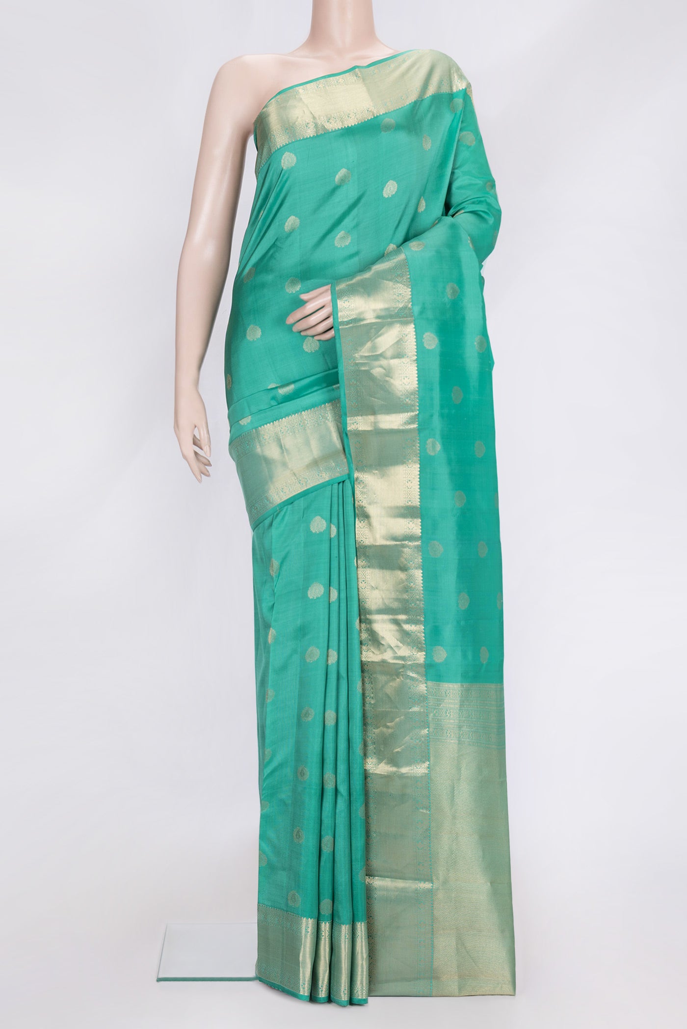 Sea Green Dual Tone Kanchipuram Silk Saree with Zari Butta on the body and Zari Border.  displayed on a mannequin
