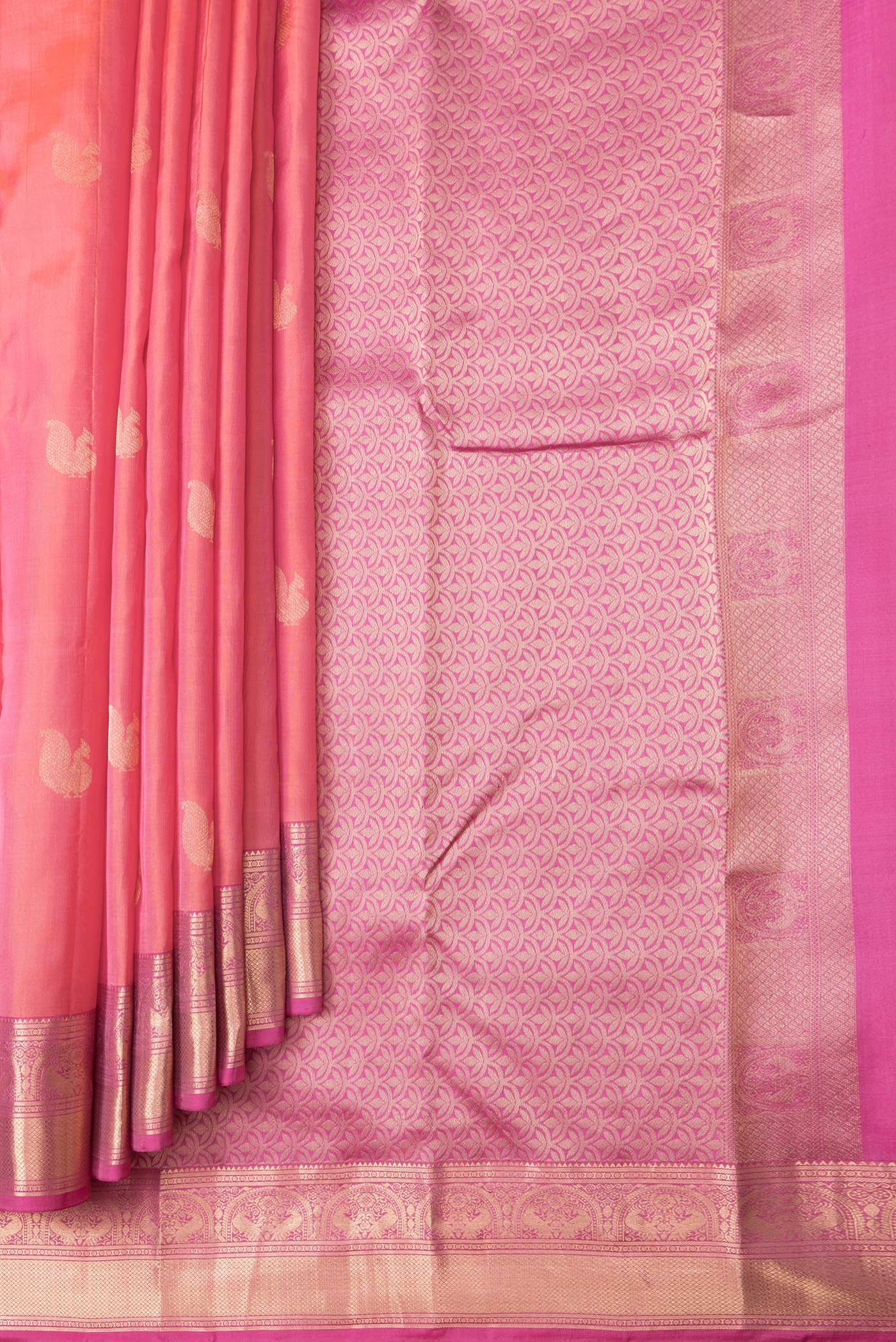 Pleats and pallu of Coral Dual Tone Kanchipuram Silk Saree with Zari Butta on the body and Zari Border. 
