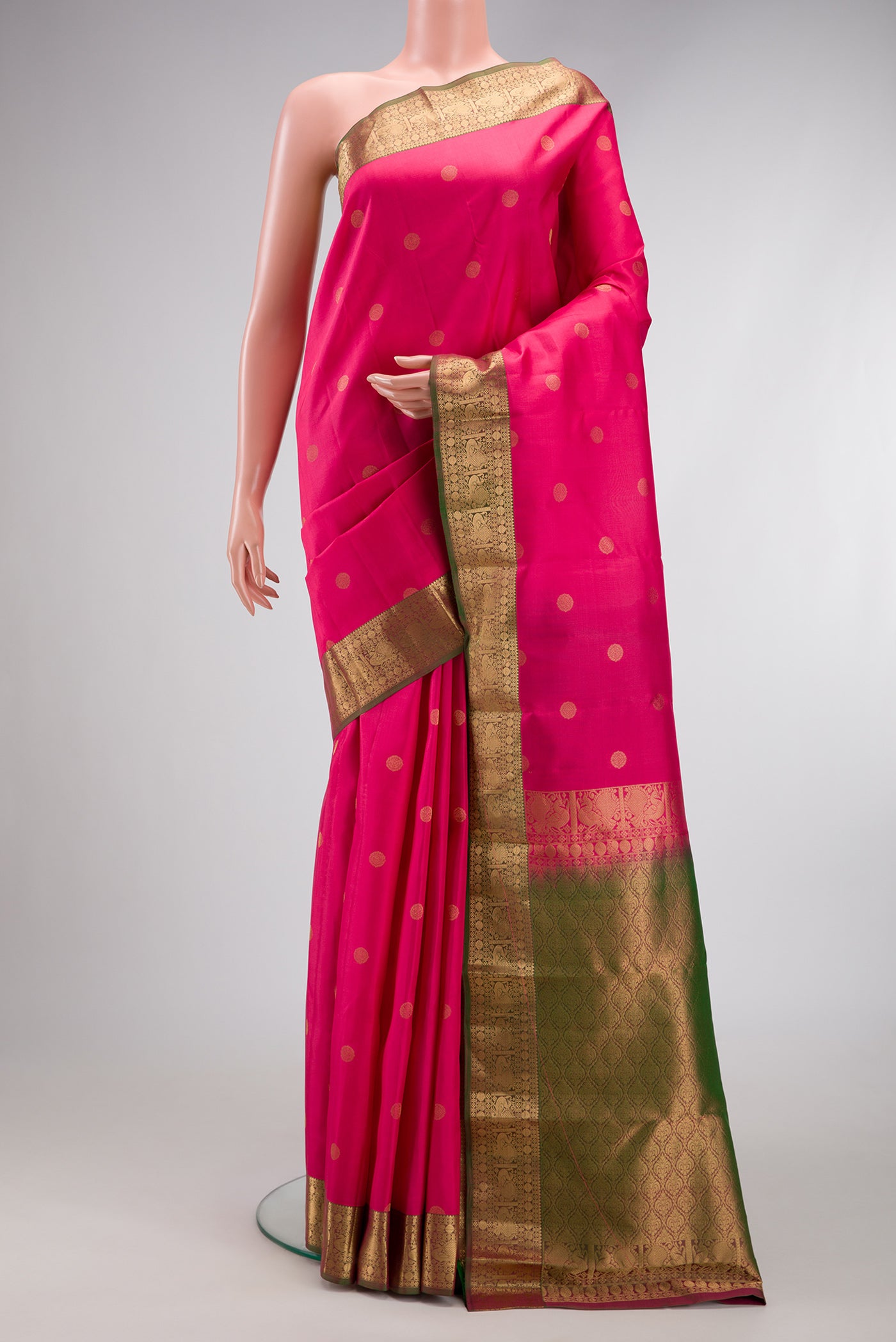 Pink Dual Tone Kanchipuram Silk Saree with Zari Butta on the body and Zari Border.  displayed on a mannequin