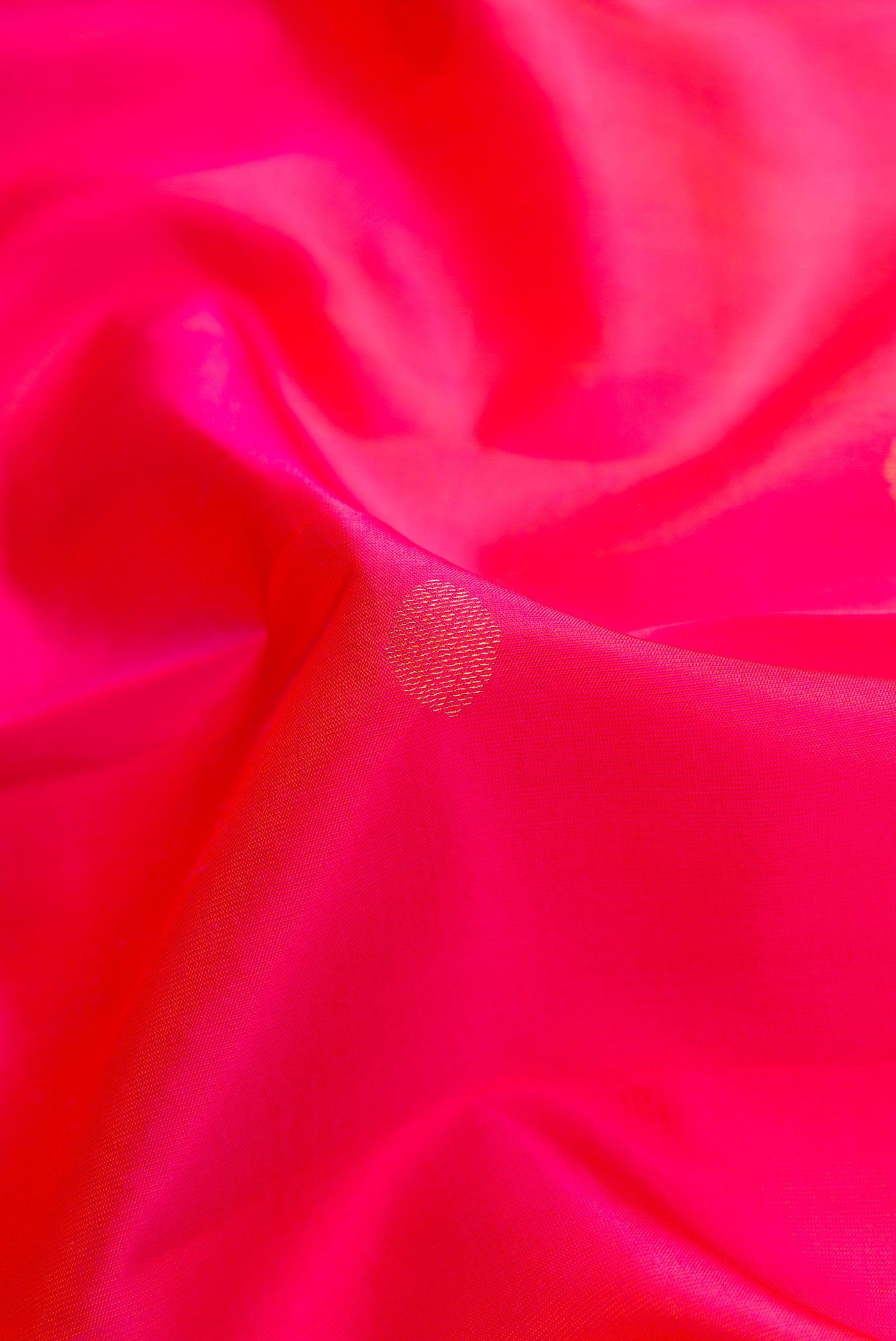 Close up of Pink Dual Tone Kanchipuram Silk Saree with Zari Butta on the body and Zari Border.  displaying folds