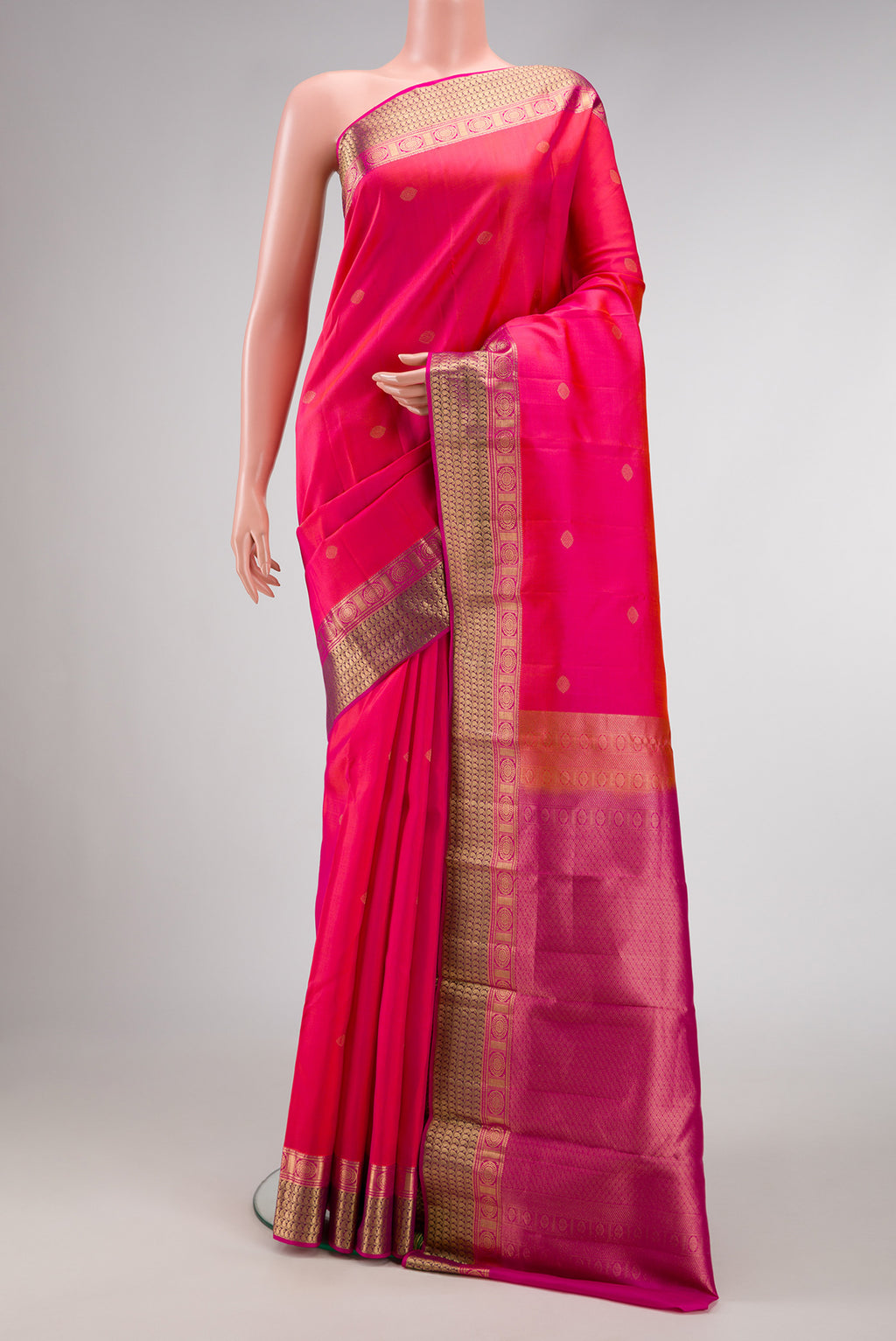 Pink Dual Tone Kanchipuram Silk Saree with Zari Butta on the body and Zari Border.  displayed on a mannequin