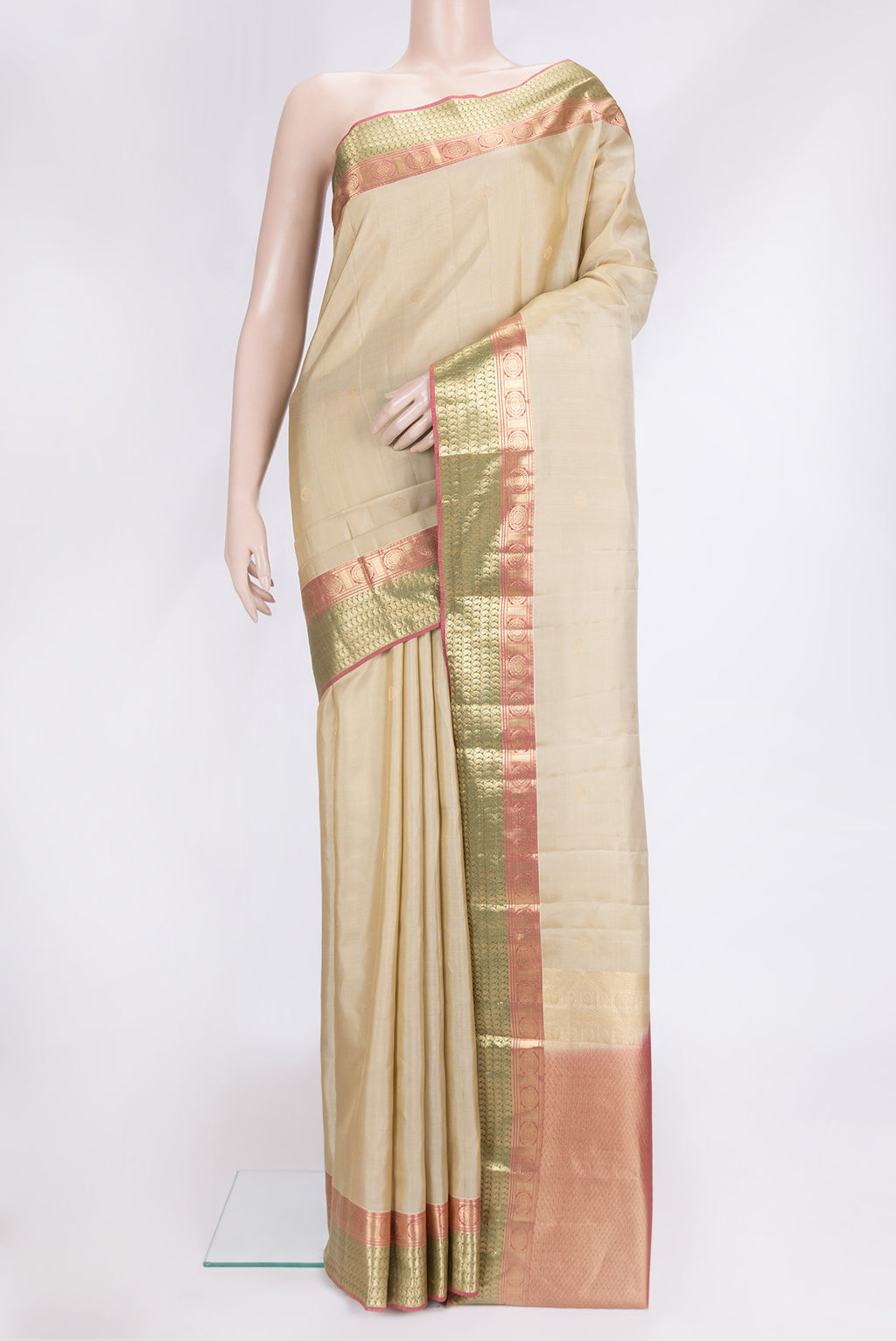 Dark Beige Dual Tone Kanchipuram Silk Saree with Zari Butta on the body and Zari Border.  displayed on a mannequin