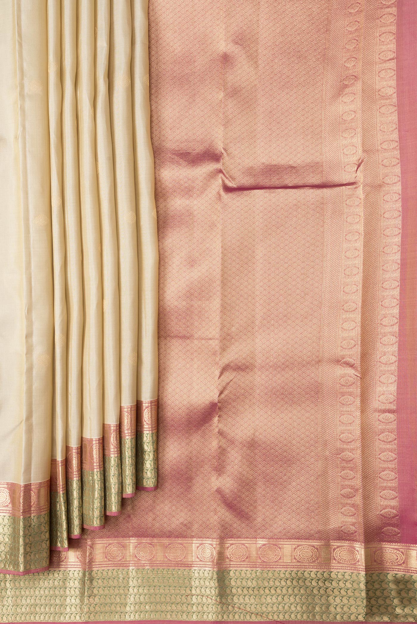 Pleats and pallu of Dark Beige Dual Tone Kanchipuram Silk Saree with Zari Butta on the body and Zari Border. 