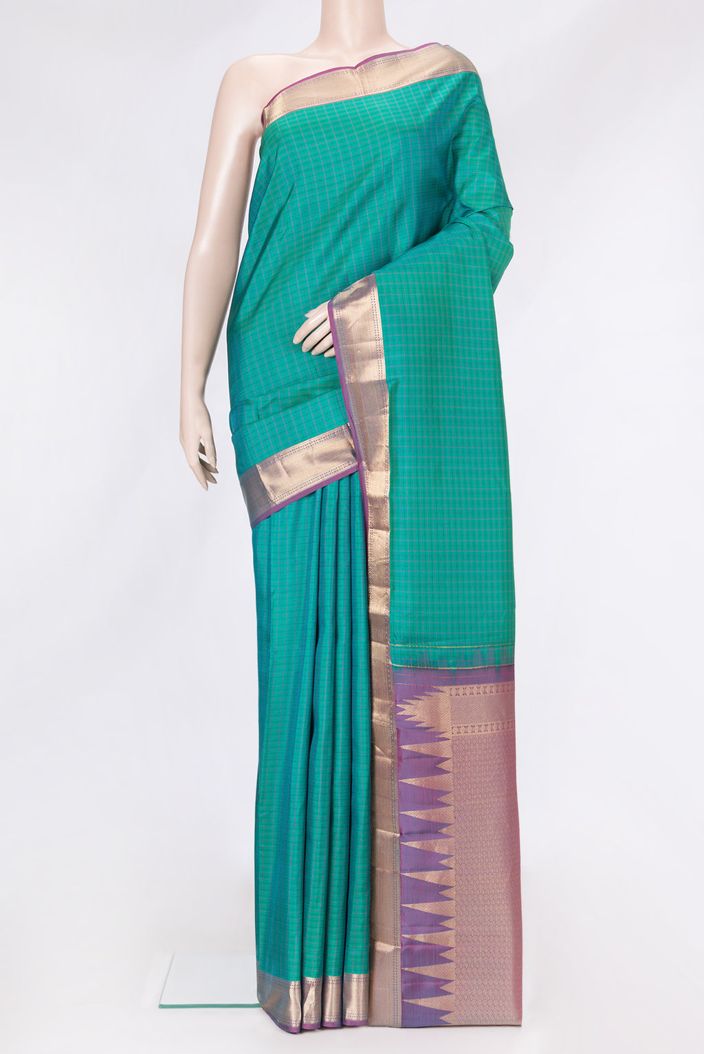 Green Dual Tone Kanchipuram Silk Saree with Checked design on the body and Zari Border.  displayed on a mannequin