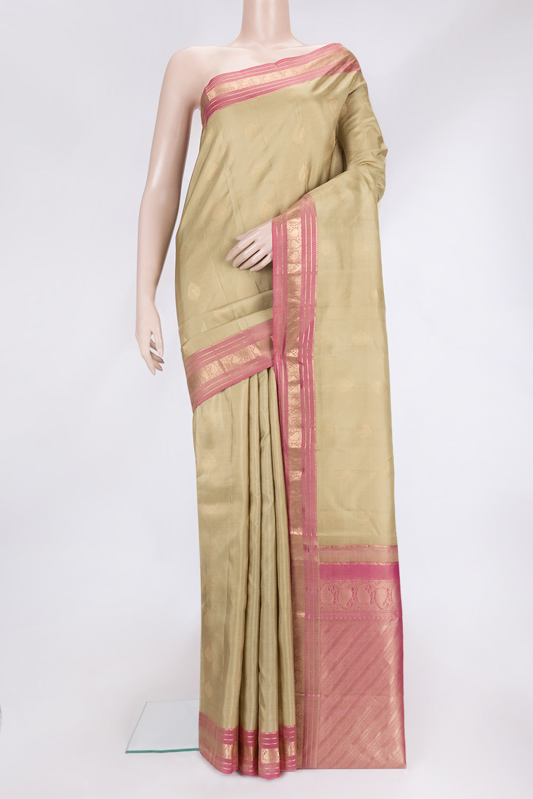 Dark Beige Dual Tone Kanchipuram Silk Saree with Zari Butta on the body and Zari Border.  displayed on a mannequin
