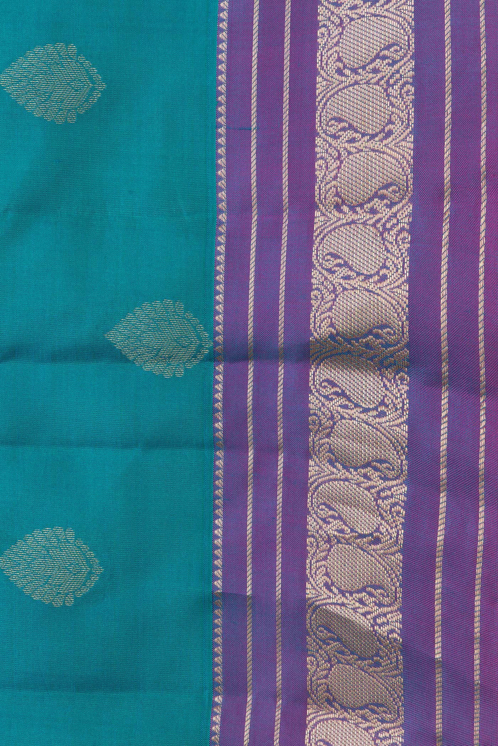 Border image of Peacock Blue Dual Tone Kanchipuram Silk Saree with Zari Butta on the body and Zari Border. 