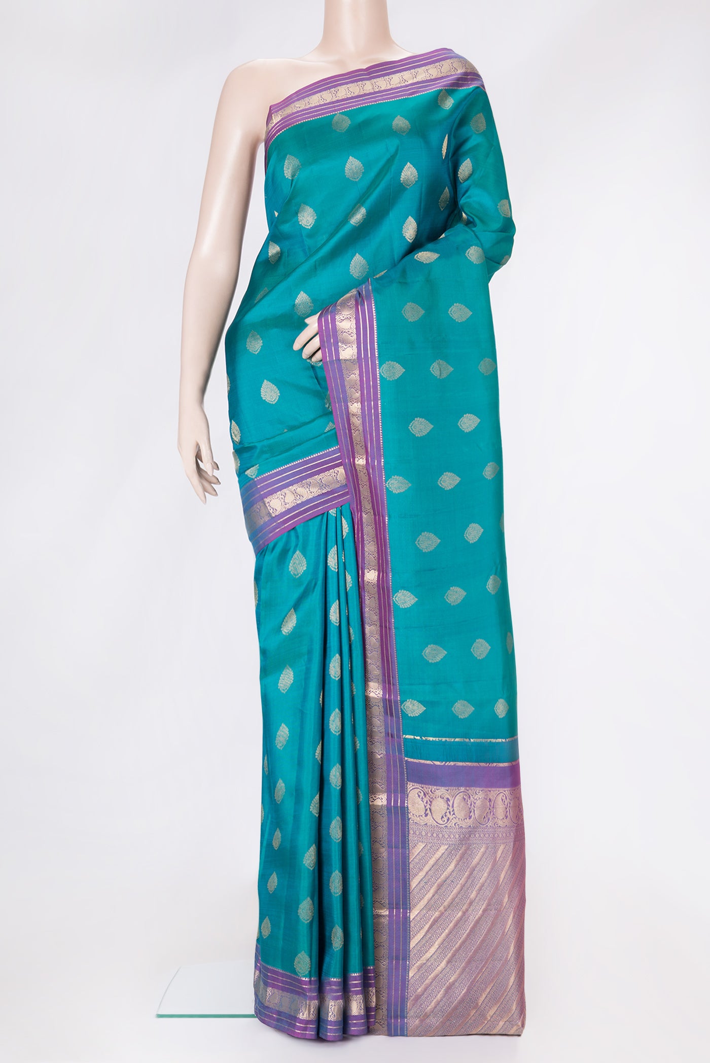Peacock Blue Dual Tone Kanchipuram Silk Saree with Zari Butta on the body and Zari Border.  displayed on a mannequin