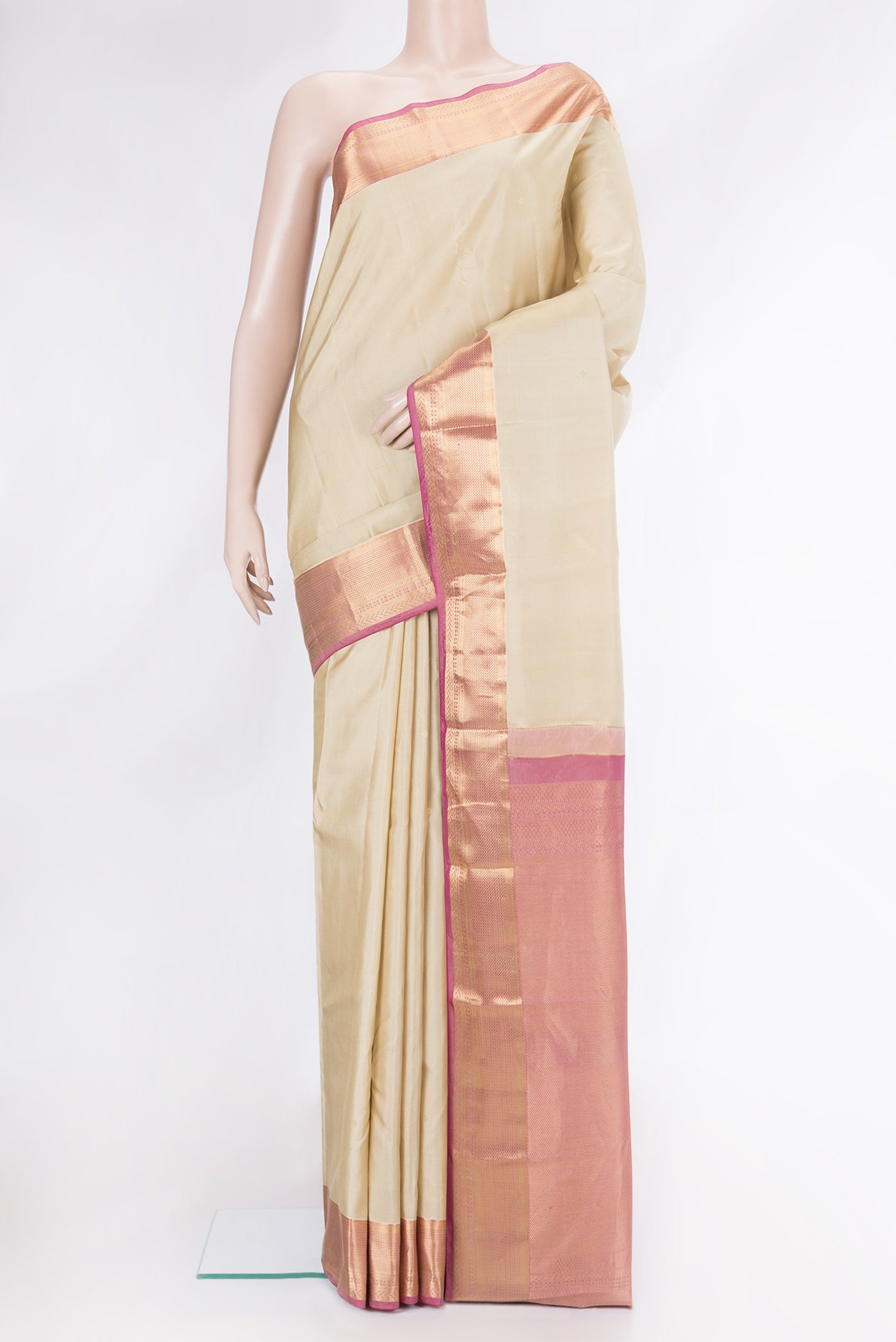 Beige Dual Tone Kanchipuram Silk Saree with Zari Butta on the body and Fancy Border.  displayed on a mannequin