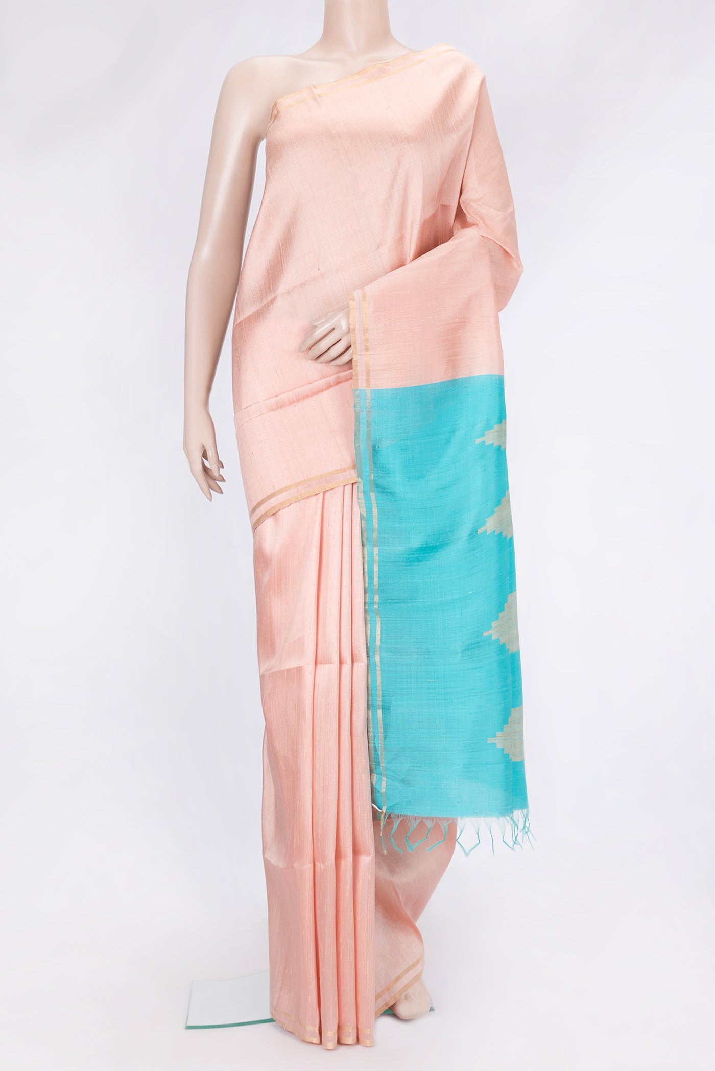 Golden Peach Dual Tone Raw Silk Saree with Plain Body and Zari Border.  displayed on a mannequin