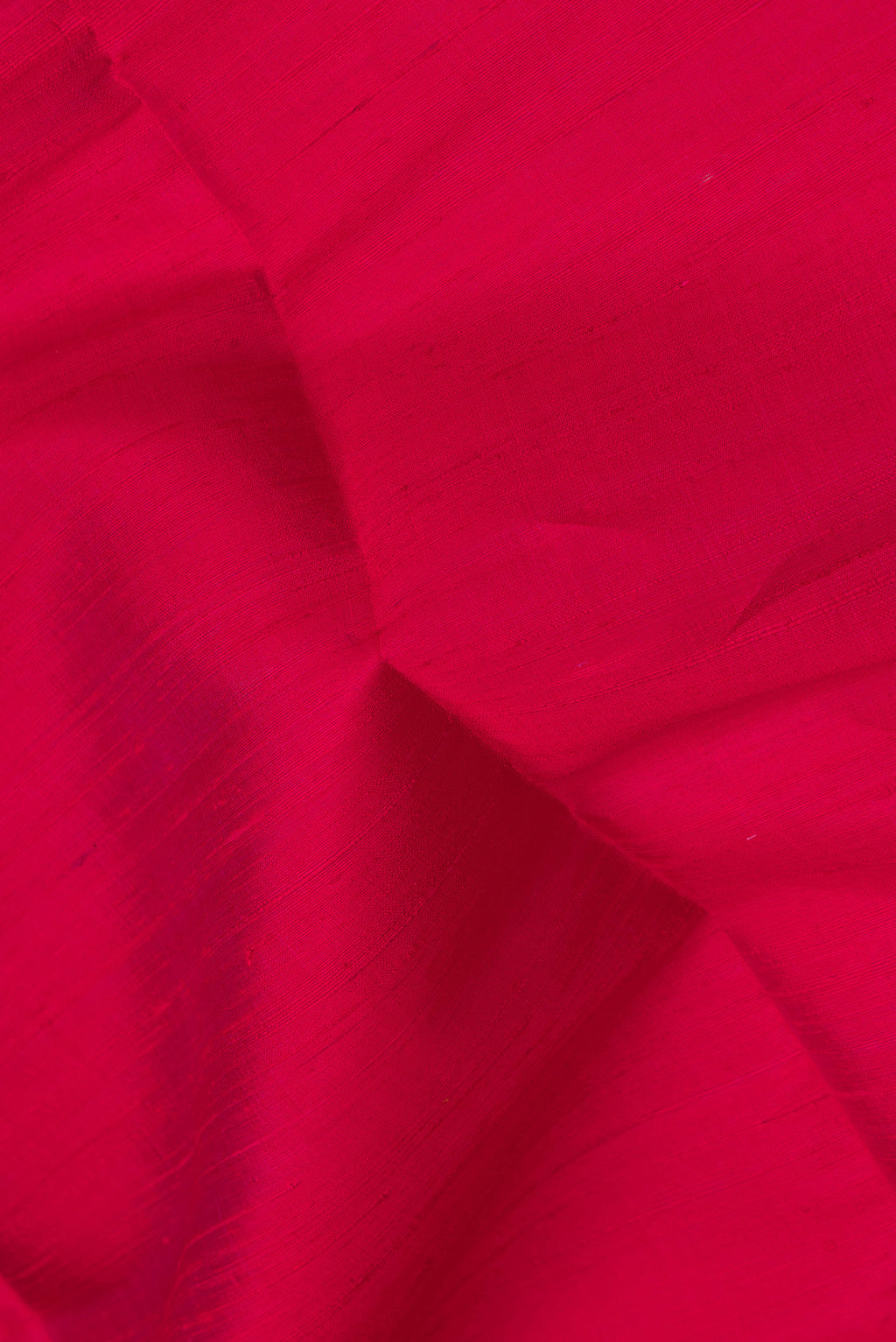 Close up of Pink Dual Tone Raw Silk Saree with Plain Body and Zari Border.  displaying folds