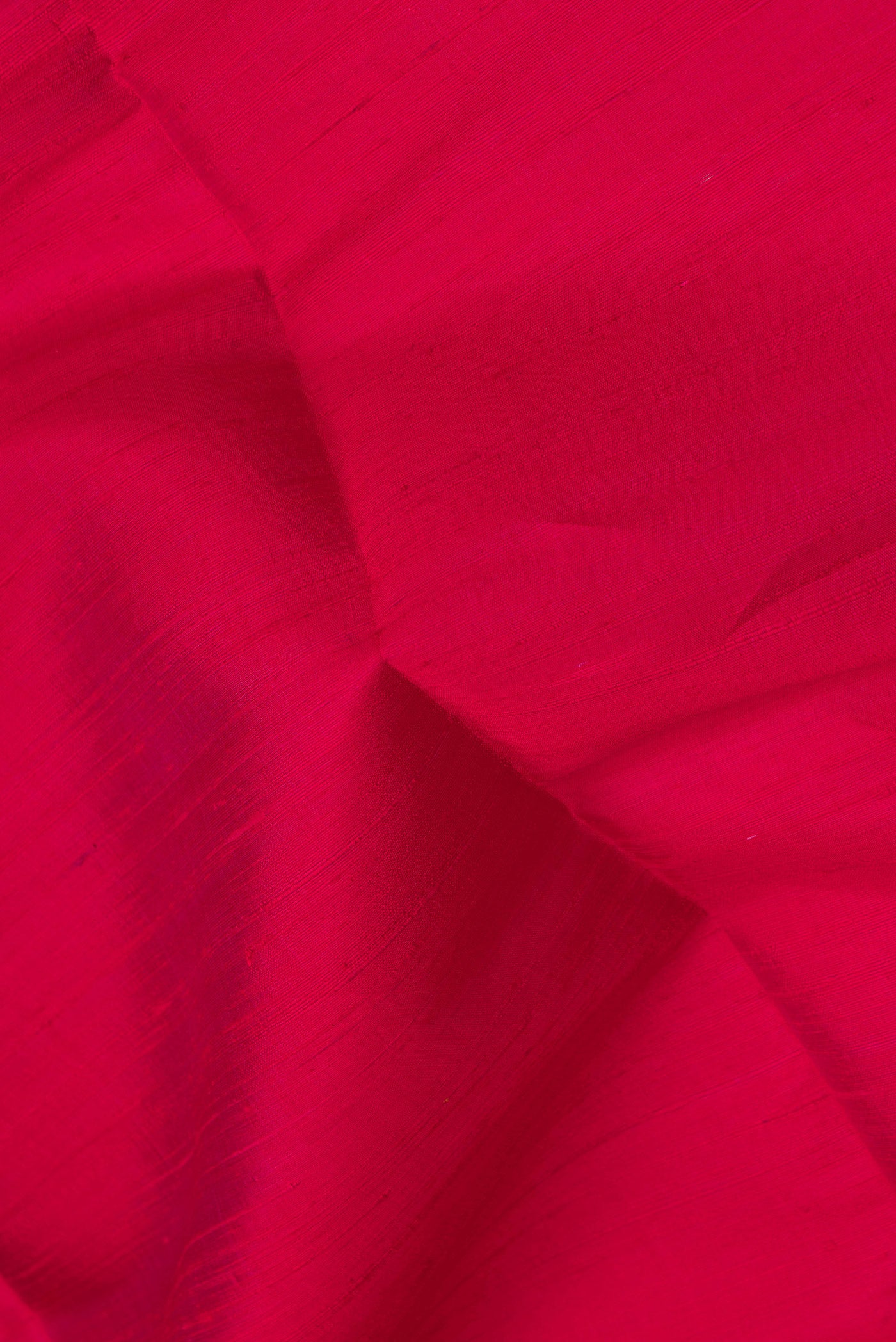 Close up of Pink Dual Tone Raw Silk Saree with Plain Body and Zari Border.  displaying folds