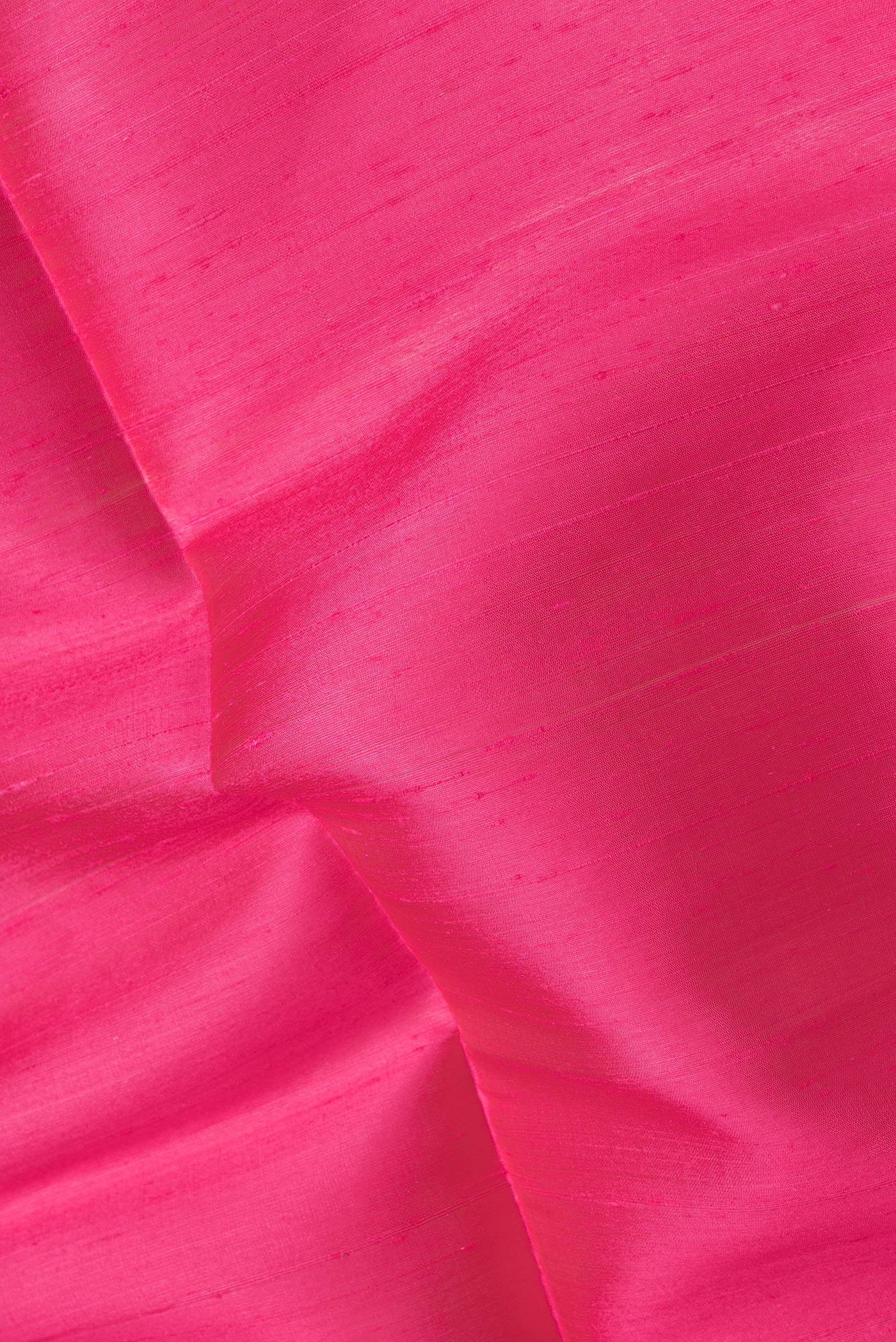 Close up of Pink Dual Tone Raw Silk Saree with Plain Body and Zari Border.  displaying folds