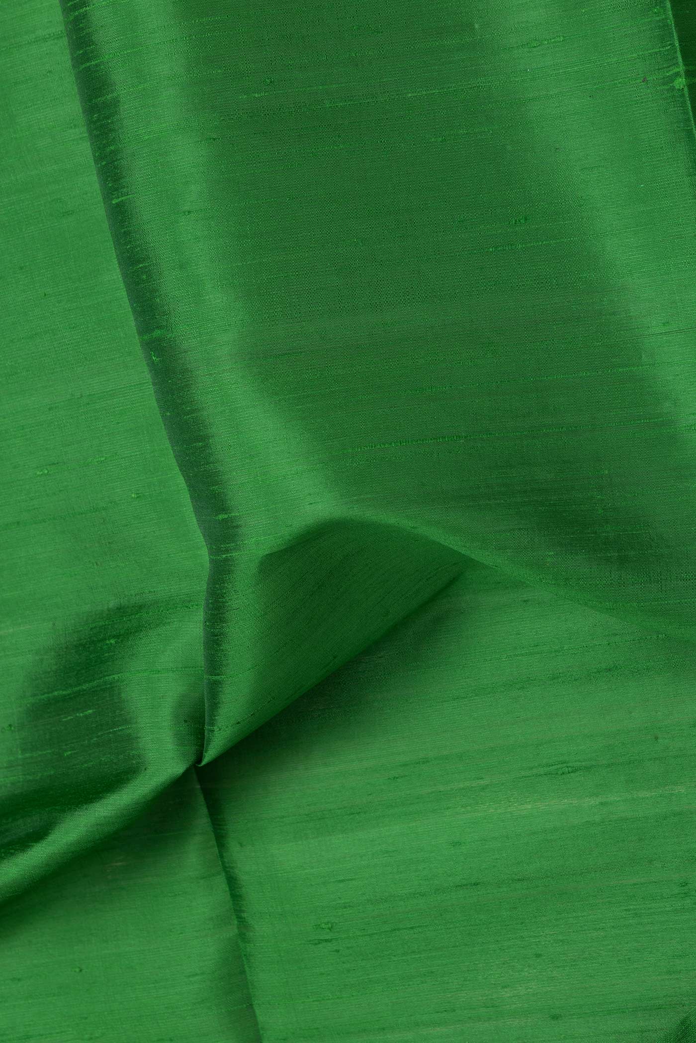 Close up of Bottle Green Dual Tone Raw Silk Saree with Plain Body and Zari Border.  displaying folds