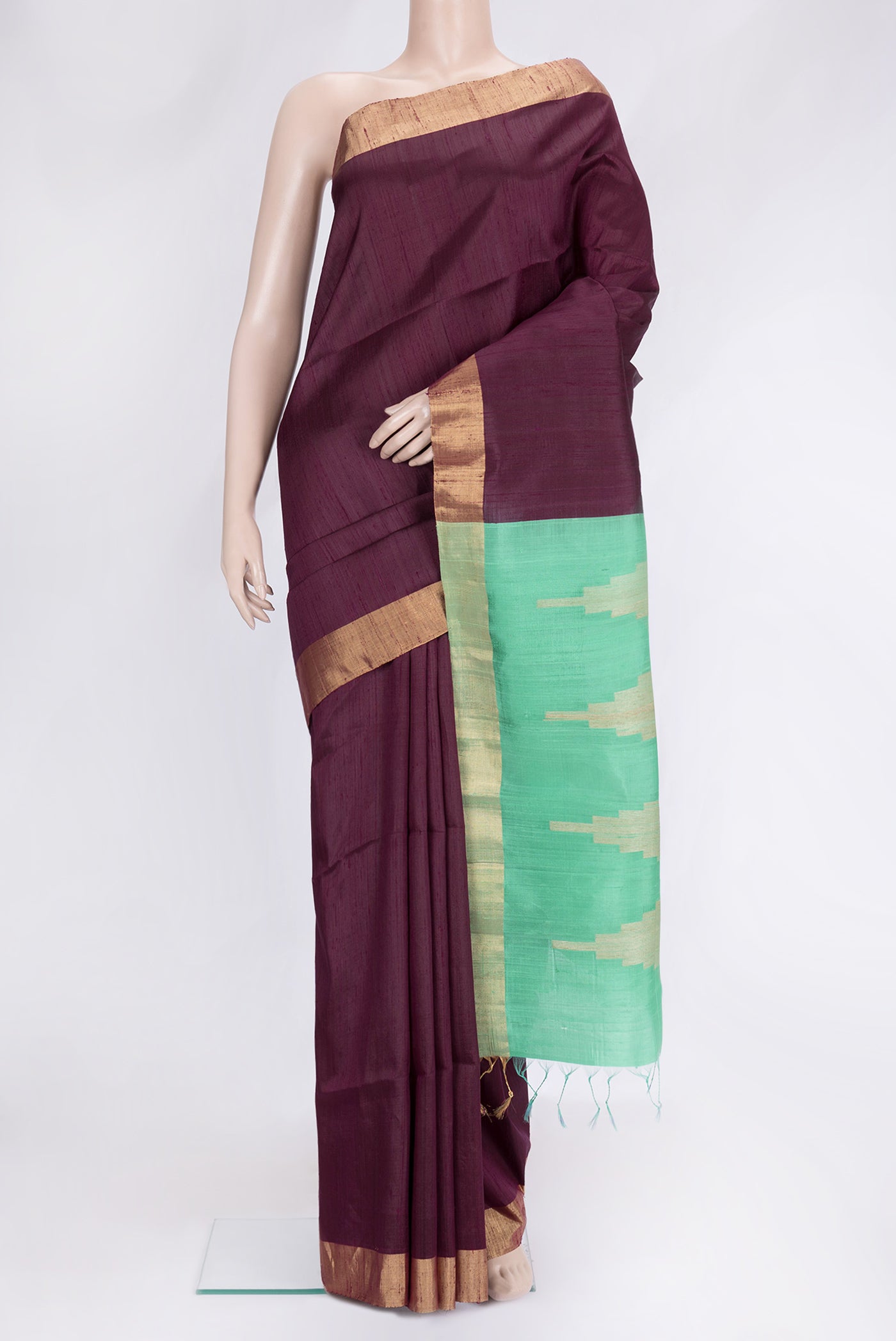 Burgundy Dual Tone Raw Silk Saree with Plain Body and Zari Border.  displayed on a mannequin