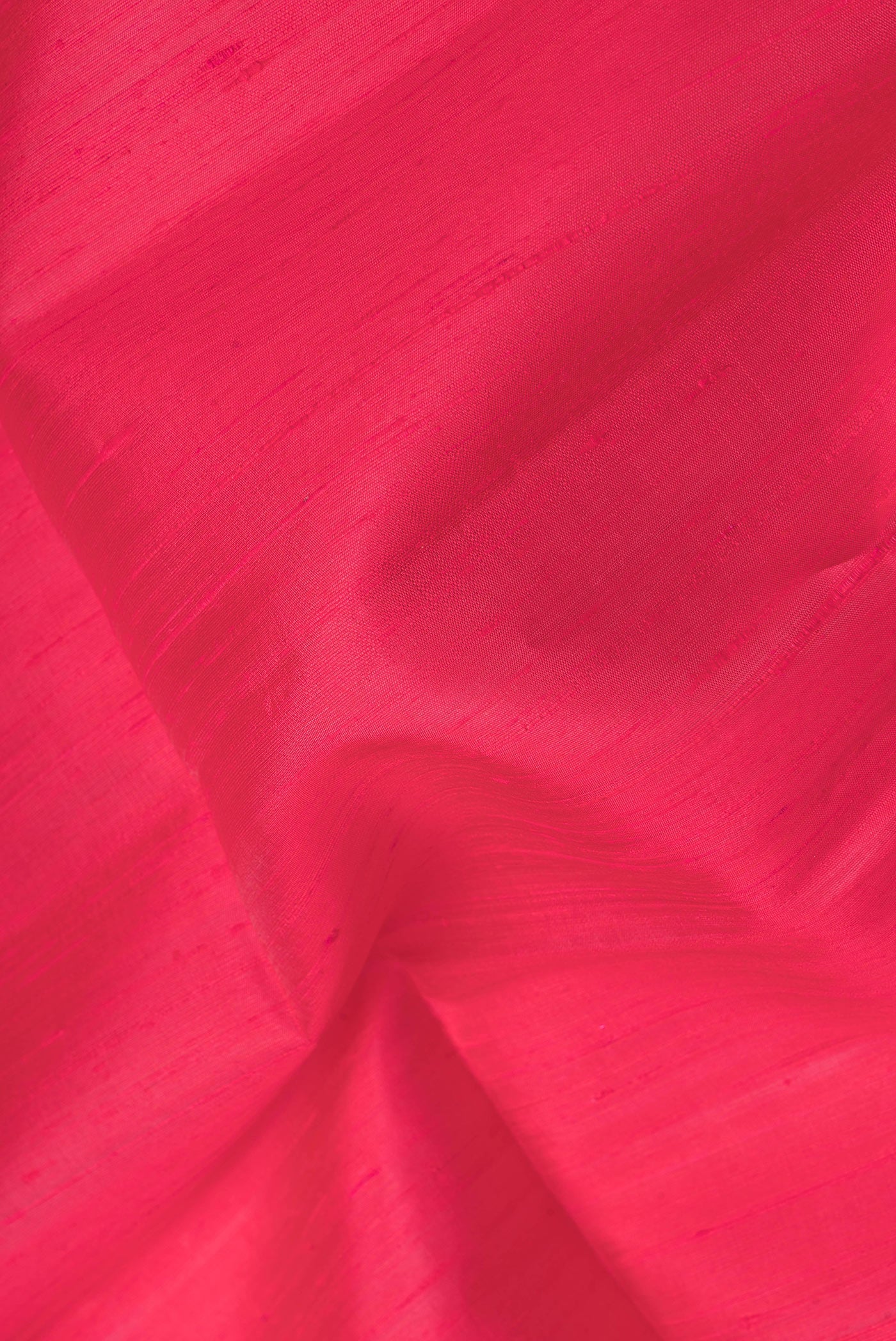 Close up of Pink Dual Tone Raw Silk Saree with Plain Body and Zari Border.  displaying folds