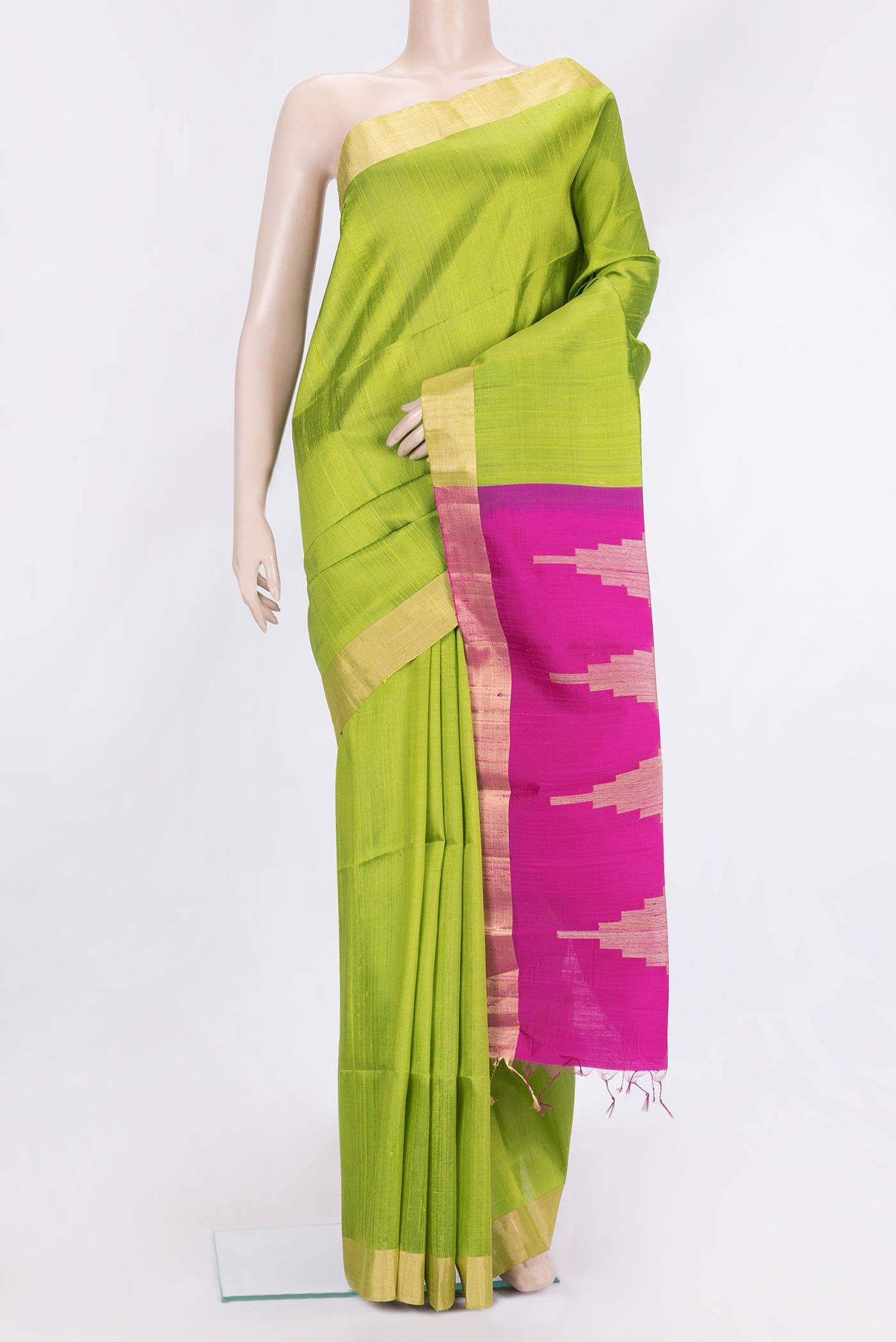 Parrot Green Dual Tone Raw Silk Saree with Plain Body and Zari Border.  displayed on a mannequin