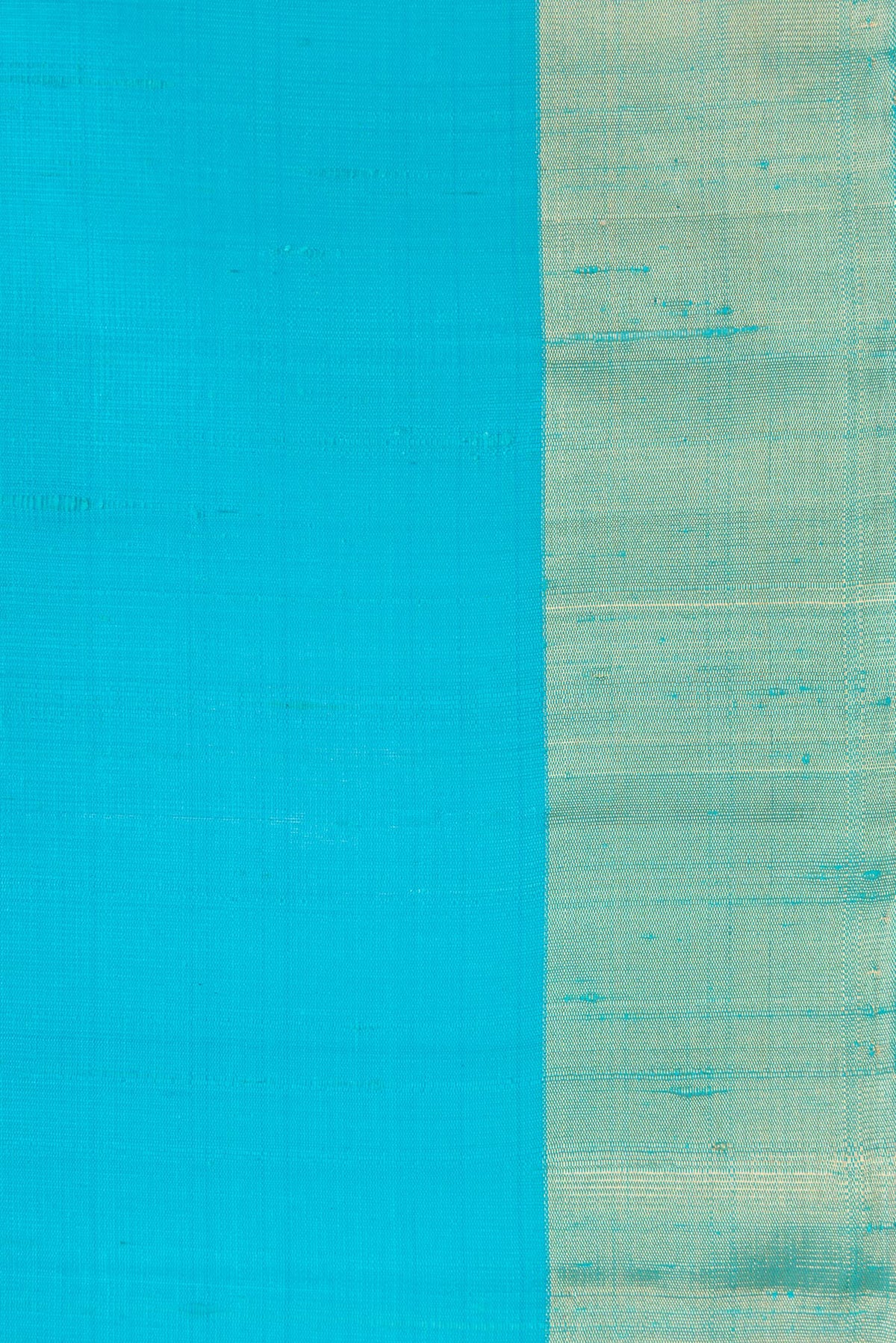 Border image of Sky Blue Dual Tone Raw Silk Saree with Plain Body and Zari Border. 