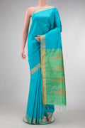 Sky Blue Dual Tone Raw Silk Saree with Plain Body and Zari Border.  displayed on a mannequin
